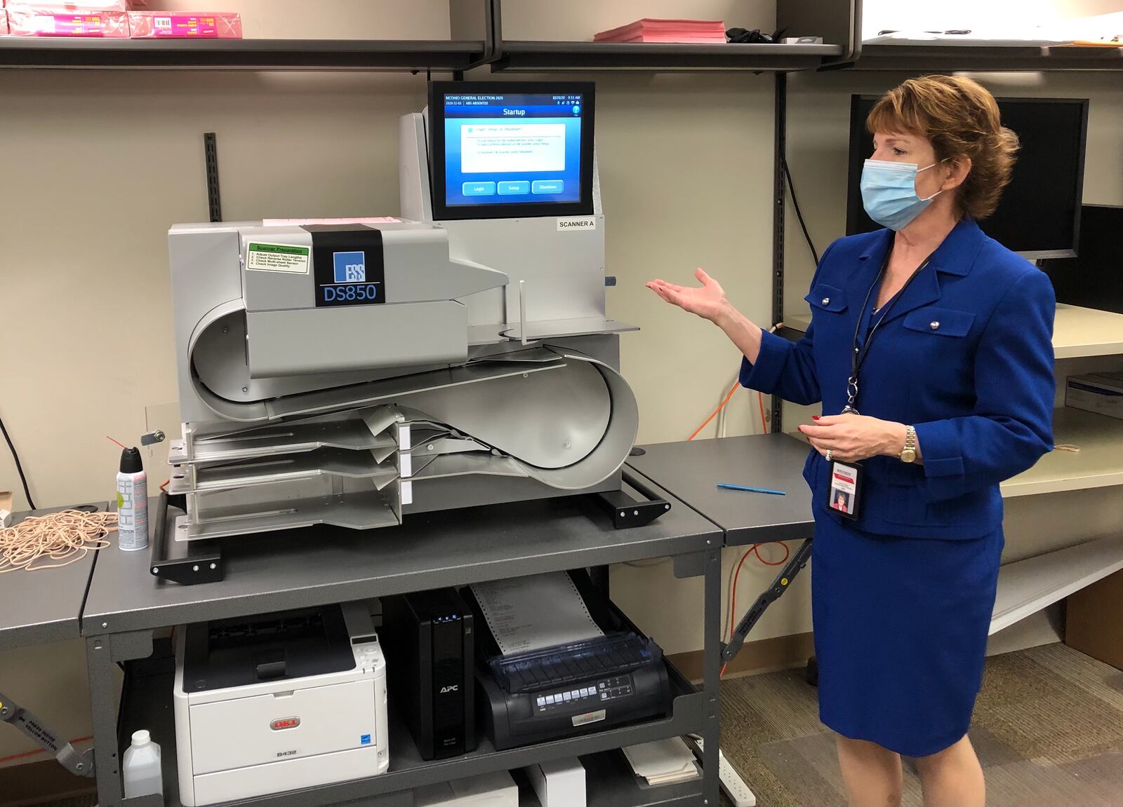 Jan Kelly, director of the Montgomery County Board of Elections, talks about a ballot scanner.