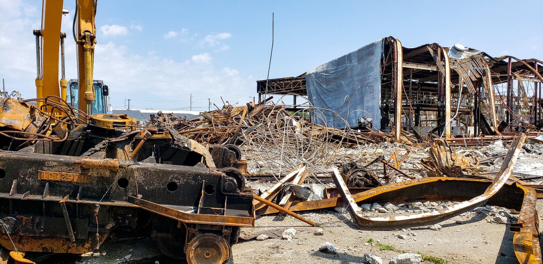 Crews demolish warehouse after massive fire in Hamilton