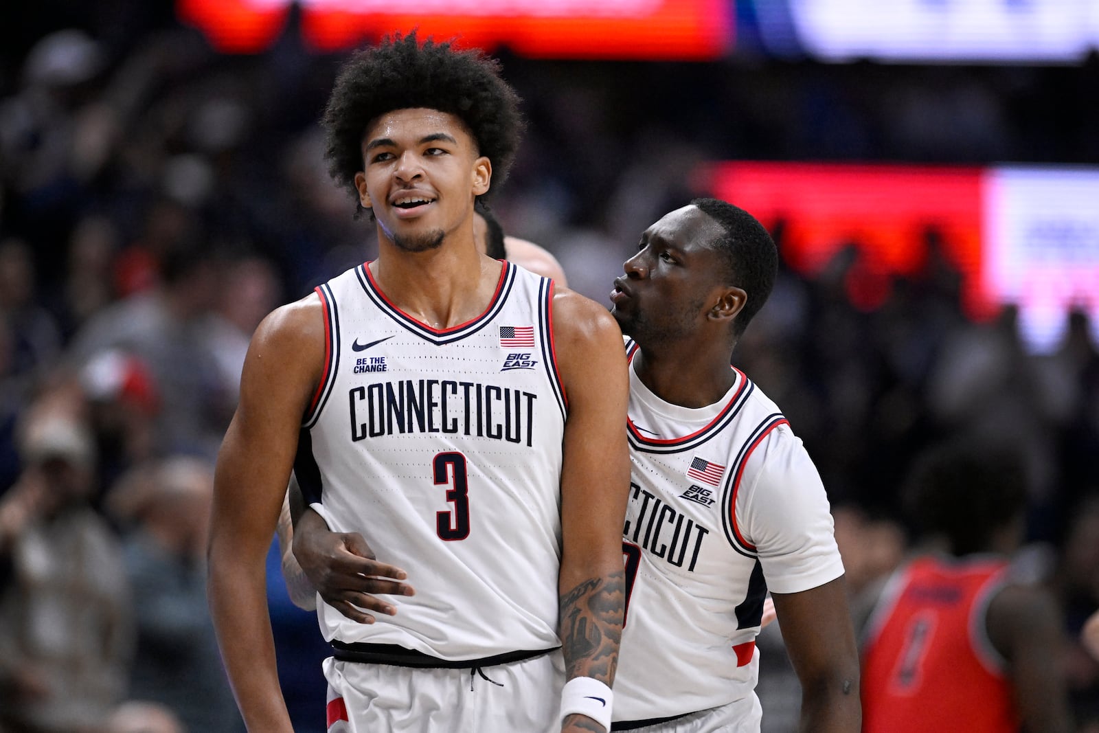 UConn guard Hassan Diarra, right, celebrates with forward Jaylin Stewart in the first half of an NCAA college basketball game against St. John's, Friday, Feb. 7, 2025, in Storrs, Conn. (AP Photo/Jessica Hill)