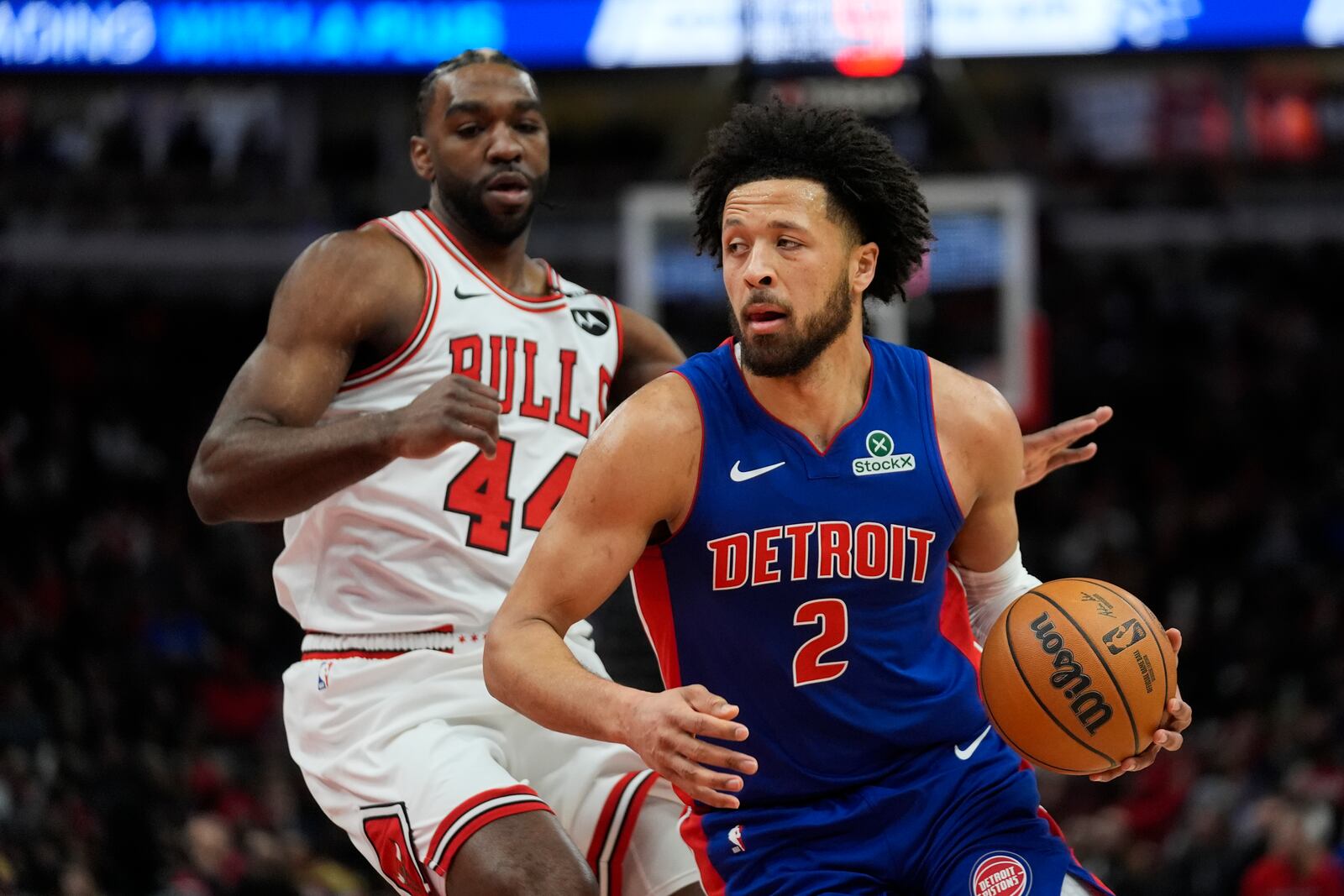 Chicago Bulls forward Patrick Williams (44), left, guards Detroit Pistons guard Cade Cunningham (2) during the first half of an NBA basketball game Tuesday, Feb. 11, 2025, in Chicago. (AP Photo/Erin Hooley)