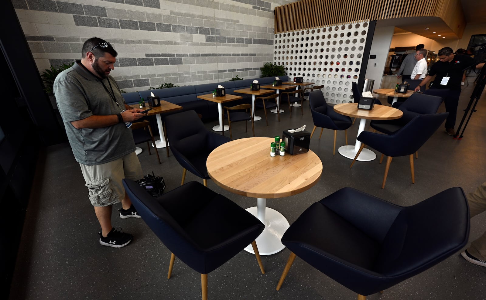 Members of the media check out a dining area next to the New York Yankees clubhouse kitchen during a tour of the upgraded team spring training facilities Thursday, Feb. 13, 2025, at George M. Steinbrenner Field in Tampa, Fla. (AP Photo/Steve Nesius)