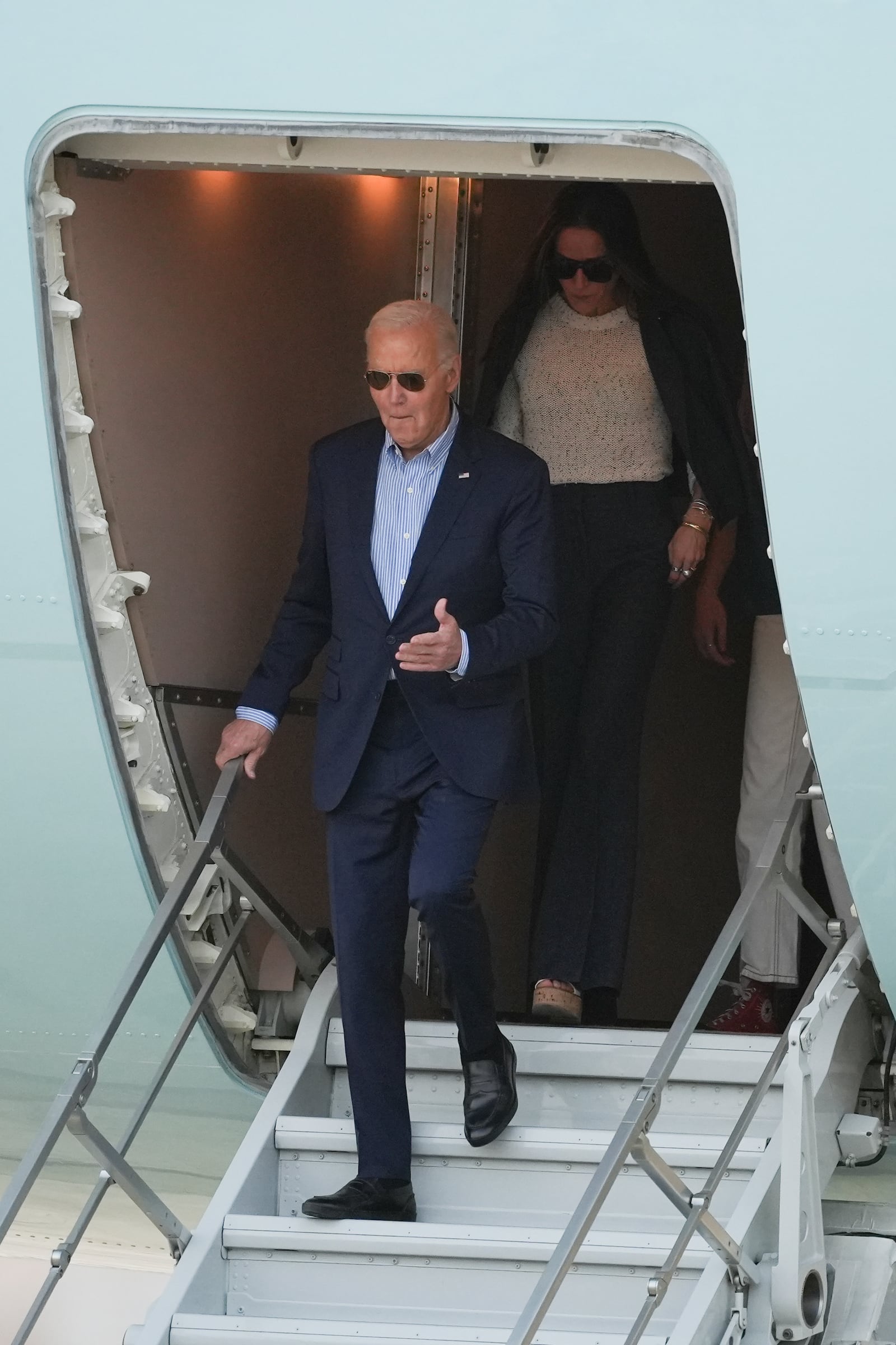 U.S. President Joe Biden deplanes in Lima, Peru, to attend the Asia-Pacific Economic Cooperation (APEC) summit, Thursday, Nov. 14, 2024. (AP Photo/Guadalupe Pardo)