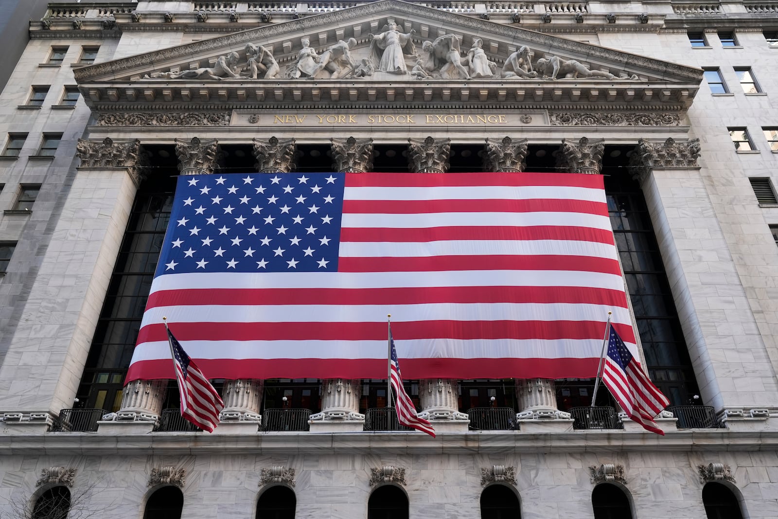 An American flag is displayed on the New York Stock Exchange in New York, Monday, Feb. 24, 2025. (AP Photo/Seth Wenig)