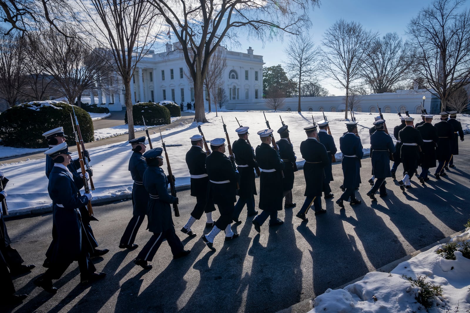 FILE - Members of the U.S. military Joint Honor Guard parade as they rehearse ahead of the upcoming presidential inauguration, at the North Lawn in front of the White House in Washington, Jan. 12, 2025. (AP Photo/Ben Curtis, File)