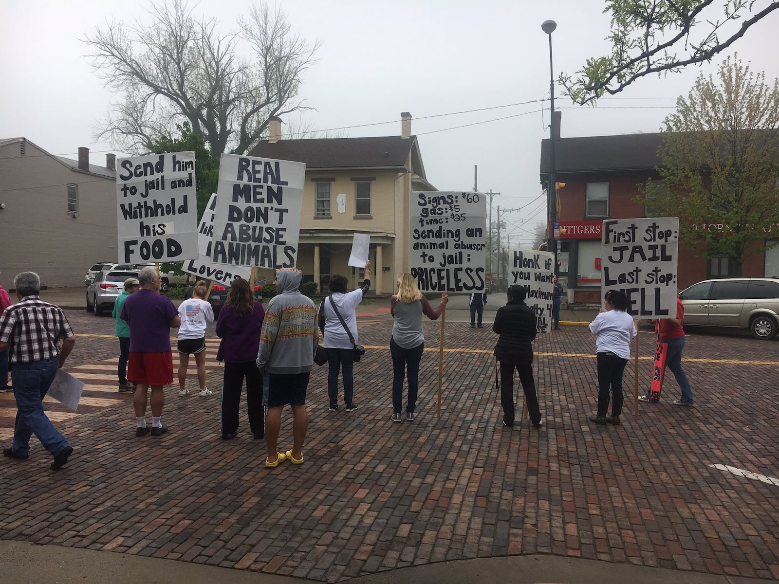 Protesters appeared outside an Oxford courthouse on Thursday, May 2, 2019, for a man's court appearance on animal cruelty charges after an emaciated dog's death. RICK McCRABB / STAFF