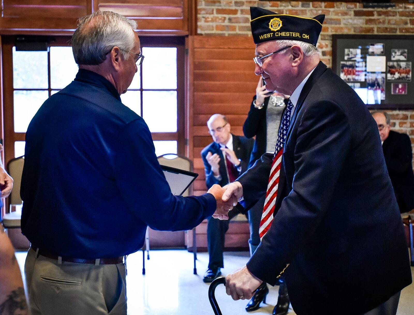 Jerry Nelson, left, one of two Veteran of the Year recipients at the annual Butler County Veteran’s Day program, is presented his award by Tom Jeffers from Butler County Veterans Service Commission Monday, Nov. 12.