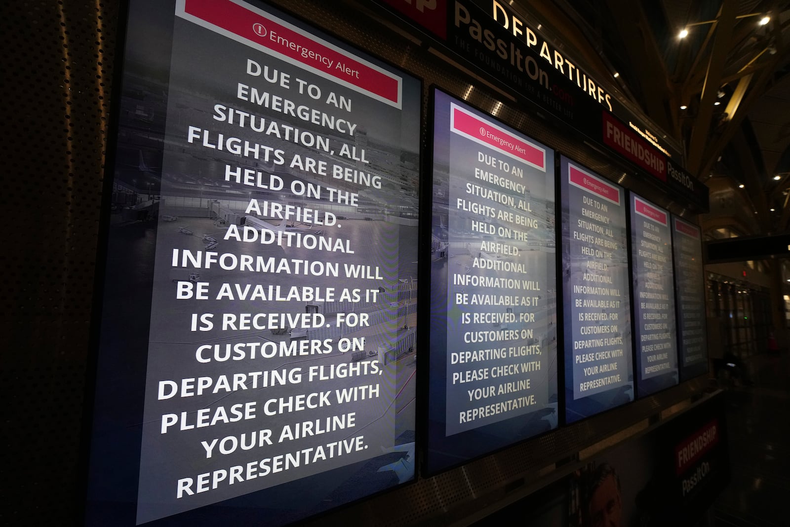 Information boards display information at Ronald Reagan Washington National Airport, Wednesday, Jan. 29, 2025, in Arlington, Va. (AP Photo/Julio Cortez)