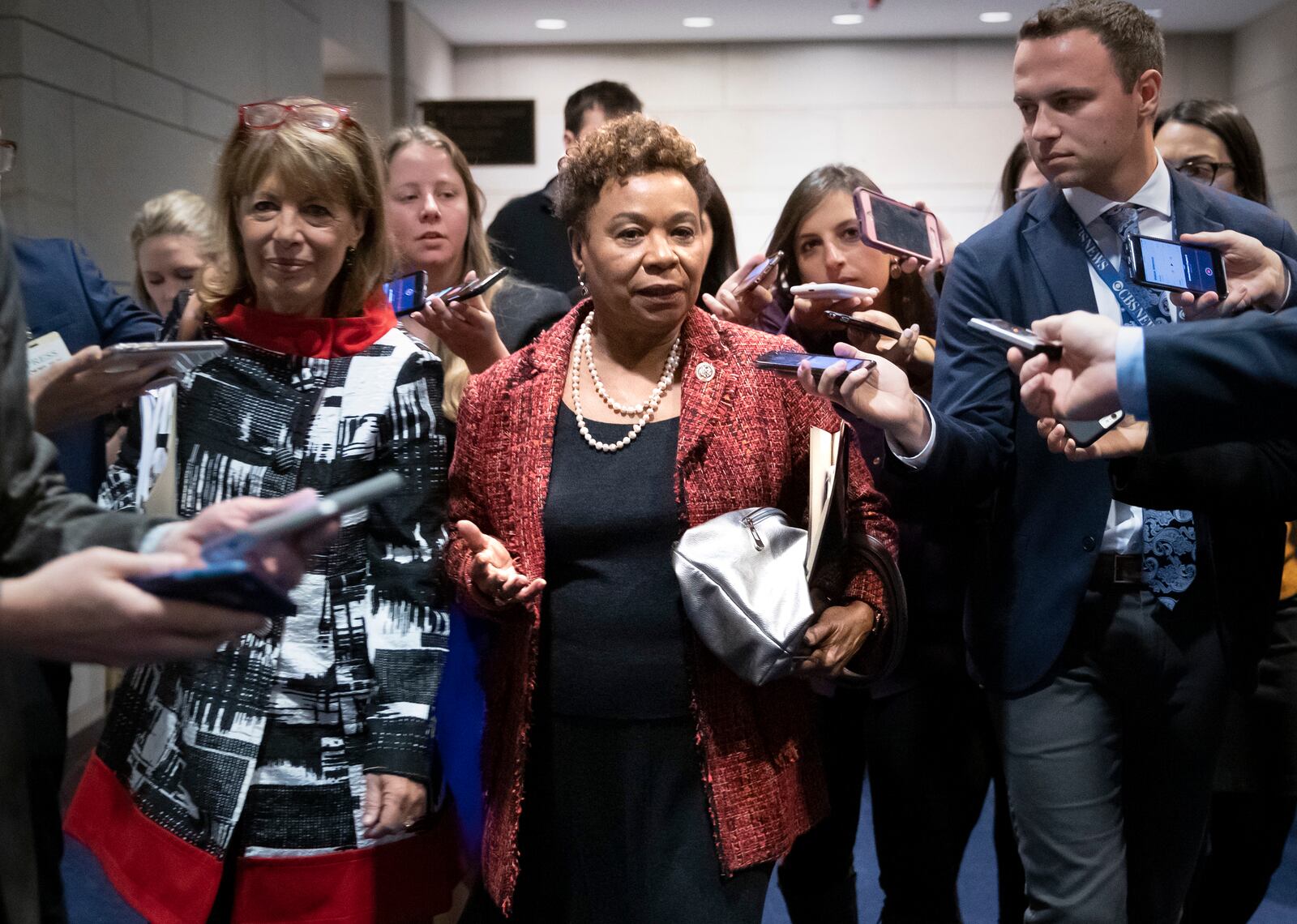 FILE—Rep. Barbara Lee, D-Calif., joined at left by Rep. Jackie Speier, D-Calif., is surrounded by reporters after she lost her bid for House Democratic Caucus chair to Rep. Hakeem Jeffries, D-N.Y., during leadership elections at the Capitol in Washington, Wednesday, Nov. 28, 2018. (AP Photo/J. Scott Applewhite, File)