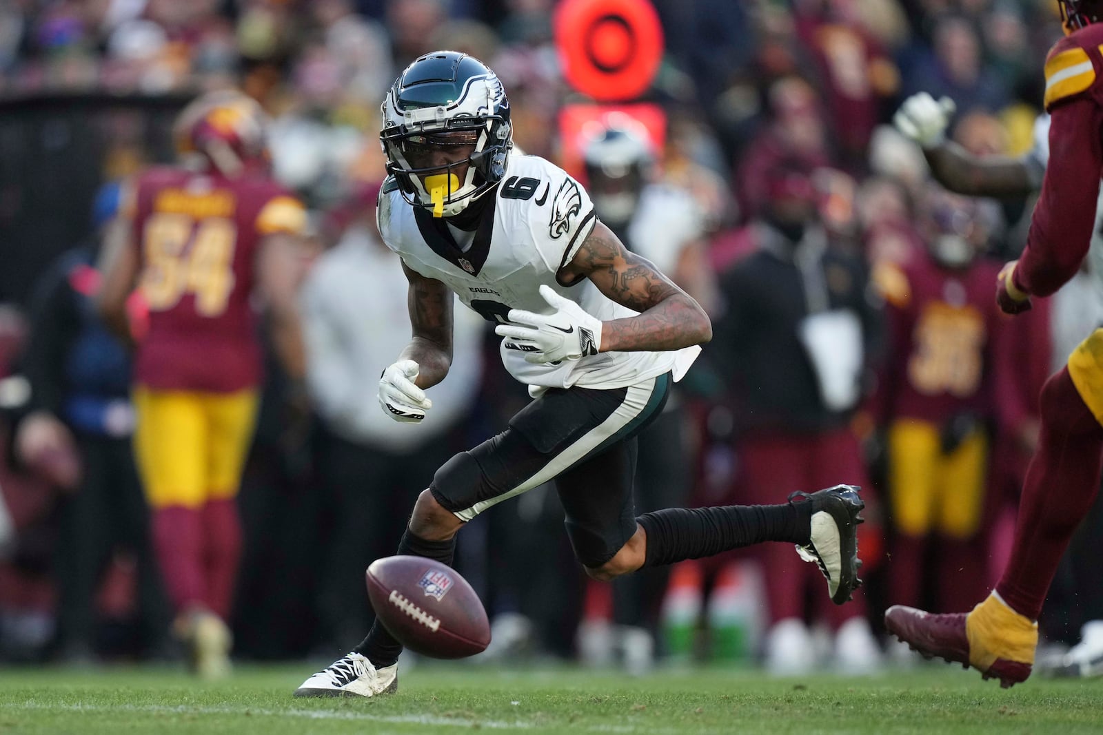 Philadelphia Eagles wide receiver DeVonta Smith (6) drops a pass during the second half of an NFL football game against the Washington Commanders, Sunday, Dec. 22, 2024, in Landover, Md. (AP Photo/Stephanie Scarbrough)