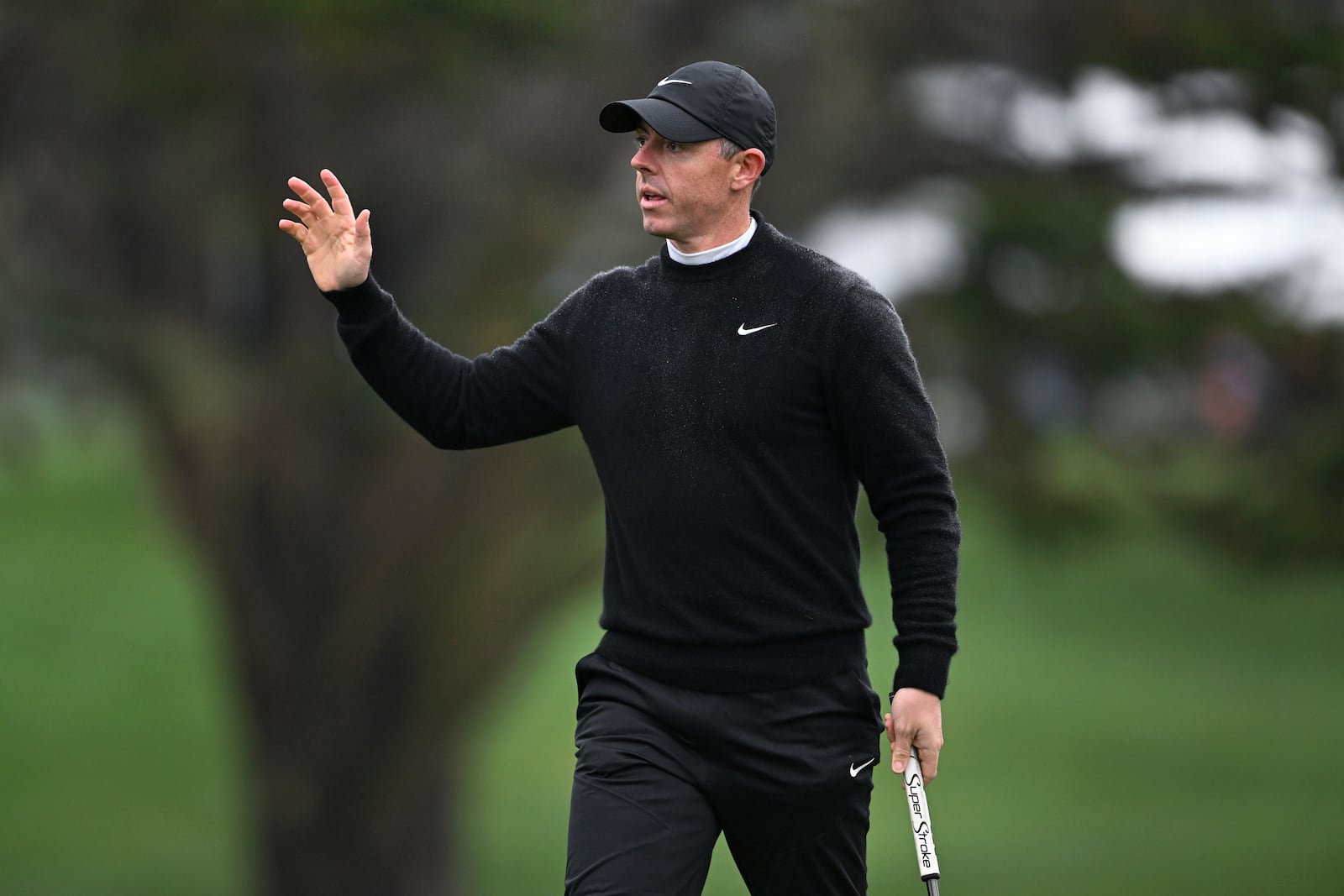 Rory McIlroy, of Northern Ireland, waves to the gallery on the 16th hole at Pebble Beach Golf Links during the third round of the AT&T Pebble Beach Pro-Am golf tournament, Saturday, Feb. 1, 2025, in Pebble Beach, Calif. (AP Photo/Nic Coury)