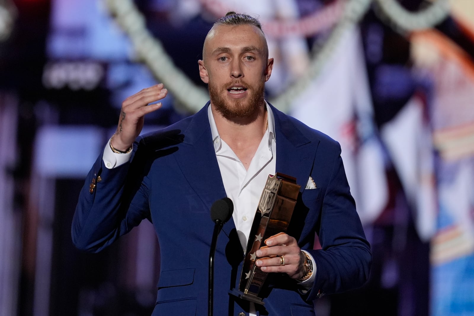 San Francisco 49ers' George Kittle accepts the Salute to service award and speaks during the NFL Honors award show ahead of the Super Bowl 59 football game, Thursday, Feb. 6, 2025, in New Orleans. (AP Photo/David J. Phillip)