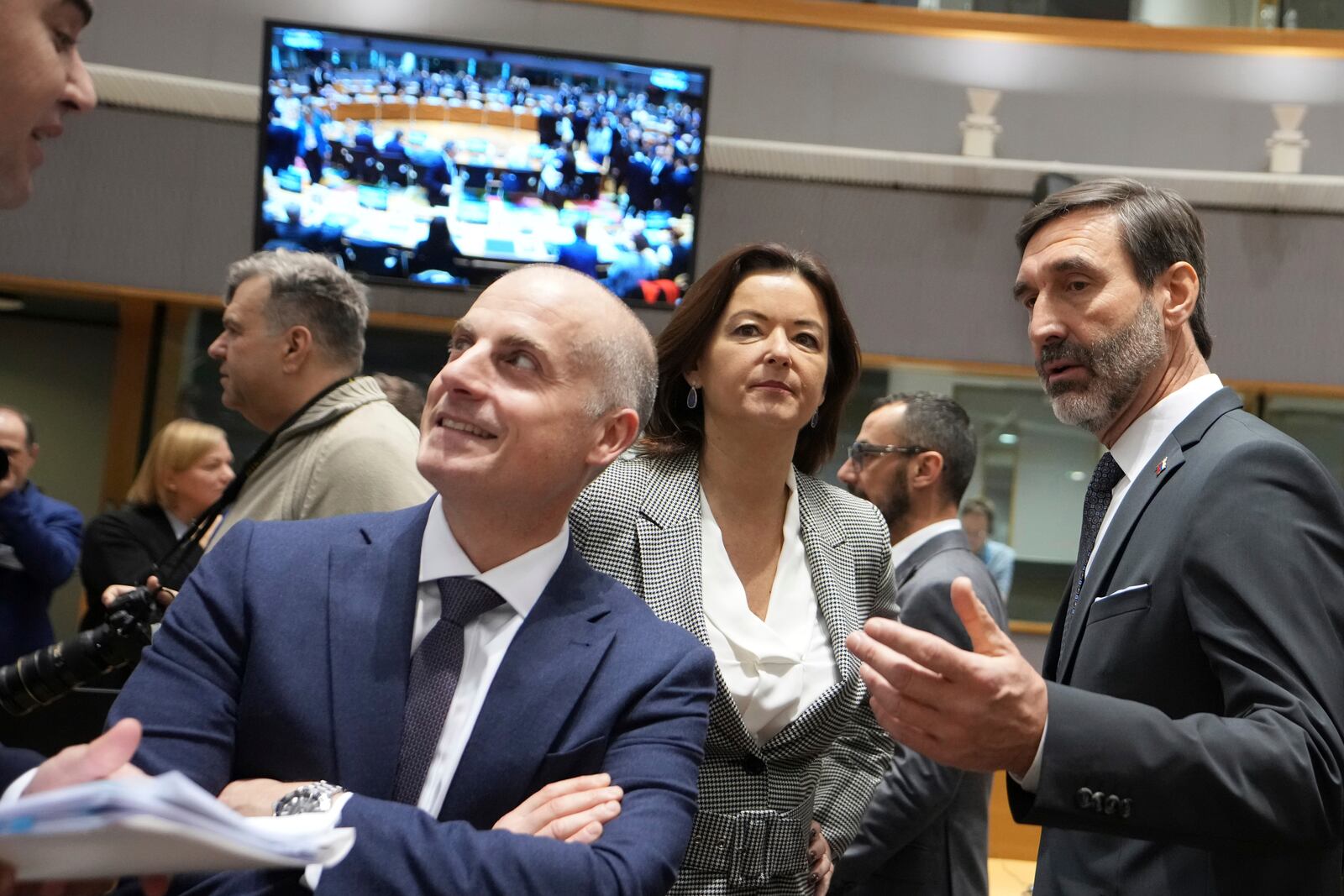 Slovakia's Foreign Minister Juraj Blanar, right, speaks with Slovenia's Foreign Minister Tanja Fajon, second right, during a round table meeting of EU foreign ministers at the European Council building in Brussels, Monday, Jan. 27, 2025. (AP Photo/Virginia Mayo)