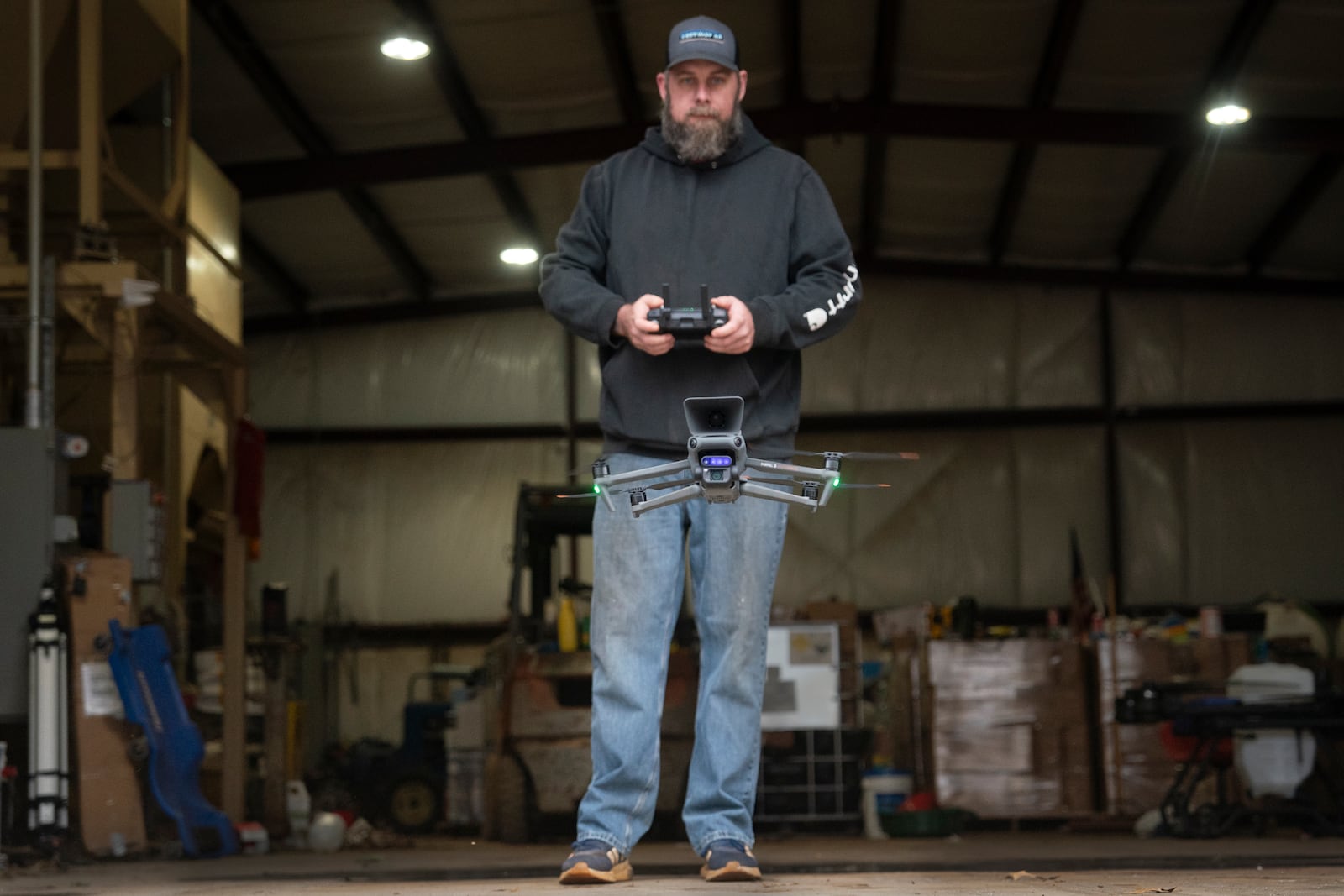 Russell Hedrick flies a drone on his farm, Tuesday, Dec. 17, 2024, in Hickory, N.C. (AP Photo/Allison Joyce)