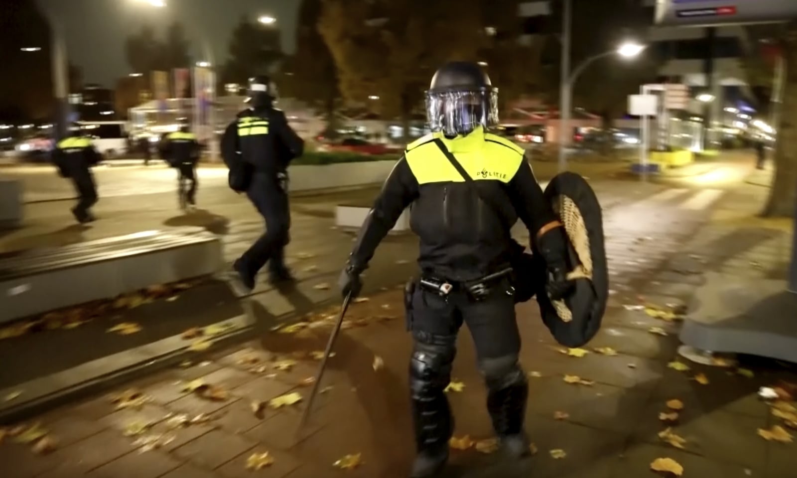 In this image taken from video, police officers patrol in riot gear on the streets of Amsterdam, Monday Nov. 11, 2024, as the city is facing tensions following violence last week. (AP Photo)