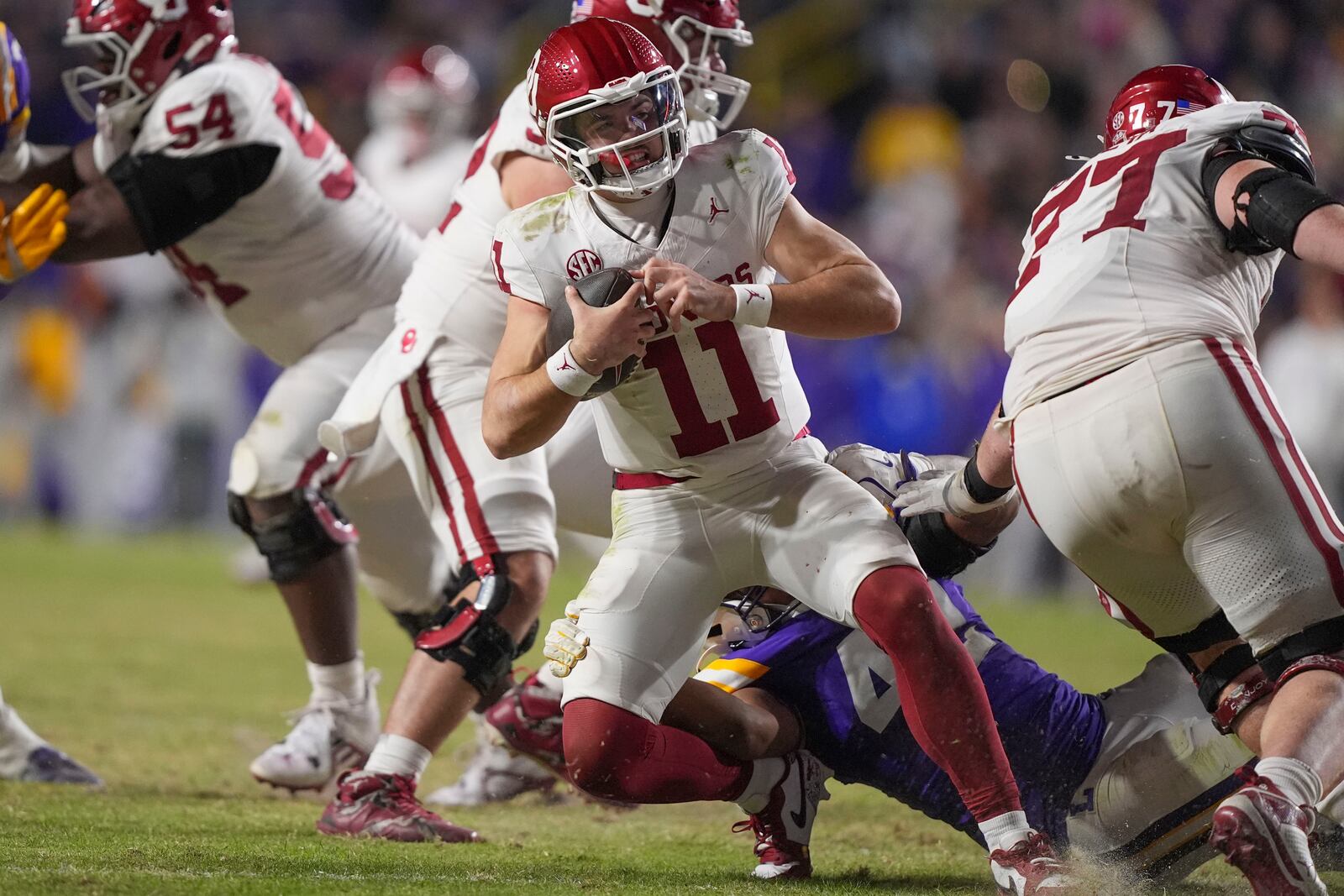 Oklahoma quarterback Jackson Arnold (11) is sacked by LSU linebacker Davhon Keys (42) in the second half an NCAA college football game in Baton Rouge, La., Saturday, Nov. 30, 2024. LSU won 37-17. (AP Photo/Gerald Herbert)