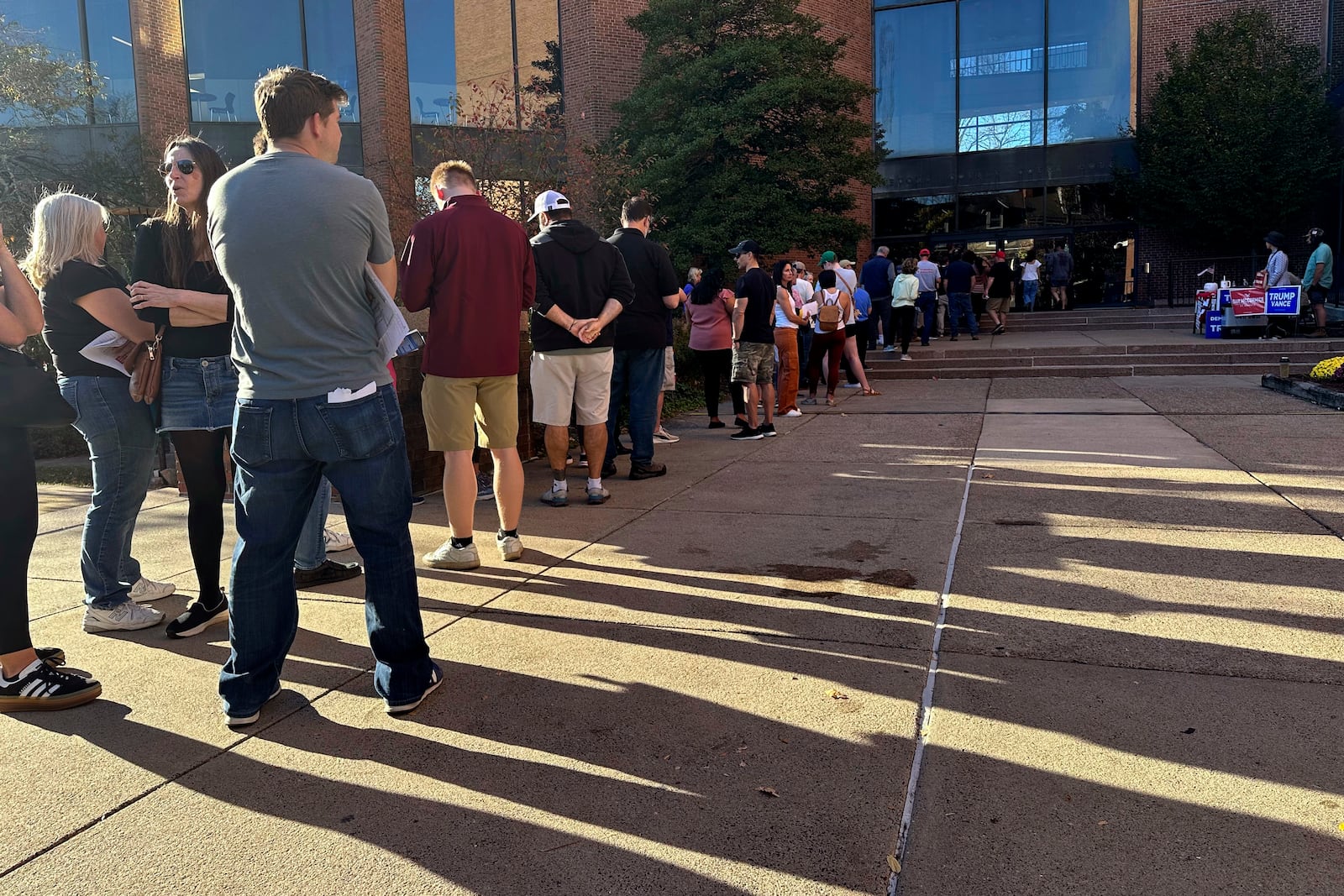 Voters line up outside the Bucks County Administration Building during early voting in the general election, Friday, Nov. 1, 2024, in Doylestown, Pa. (AP Photo/Michael Rubinkam)