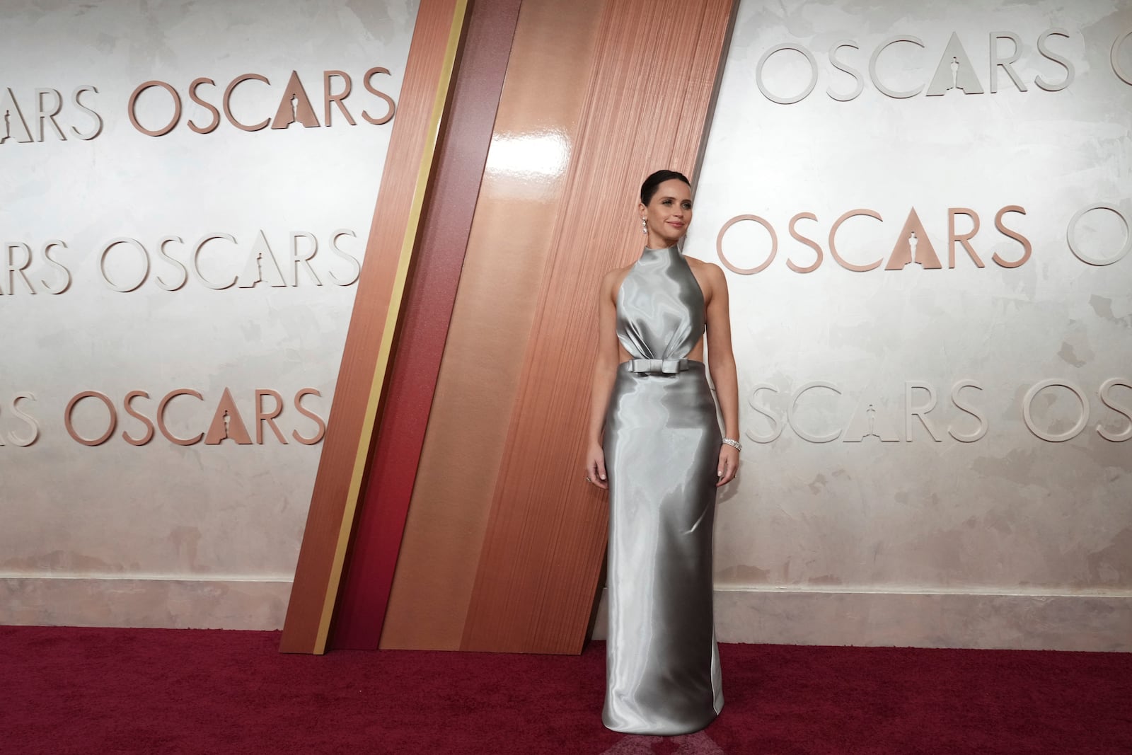 Felicity Jones arrives at the Oscars on Sunday, March 2, 2025, at the Dolby Theatre in Los Angeles. (Photo by Jordan Strauss/Invision/AP)