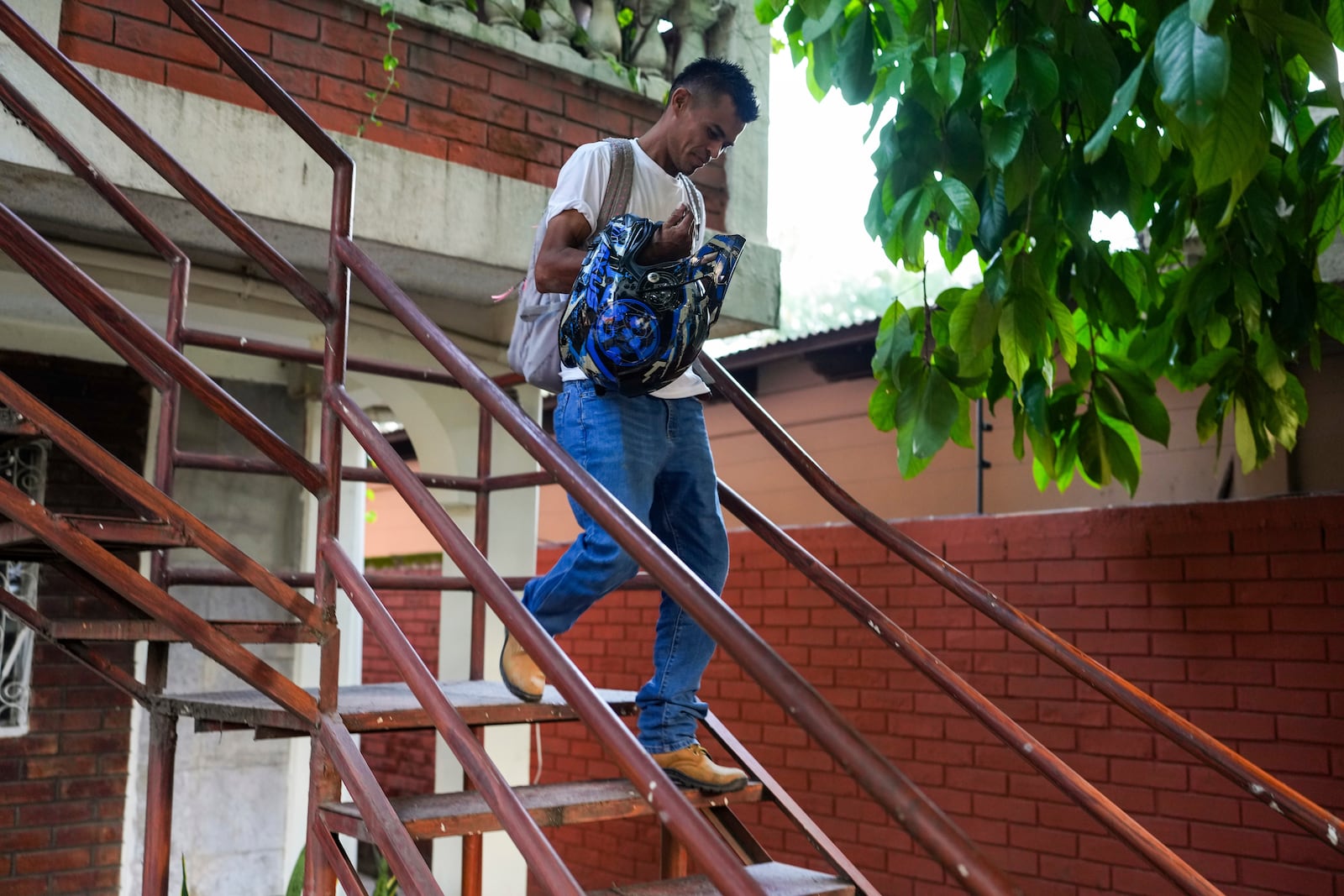 Honduran migrant Luis Miguel López, who was deported from the U.S., leaves the Mennonite Social Action Commission office in San Pedro Sula, Honduras, Tuesday, Dec. 3, 2024. (AP Photo/Moises Castillo)