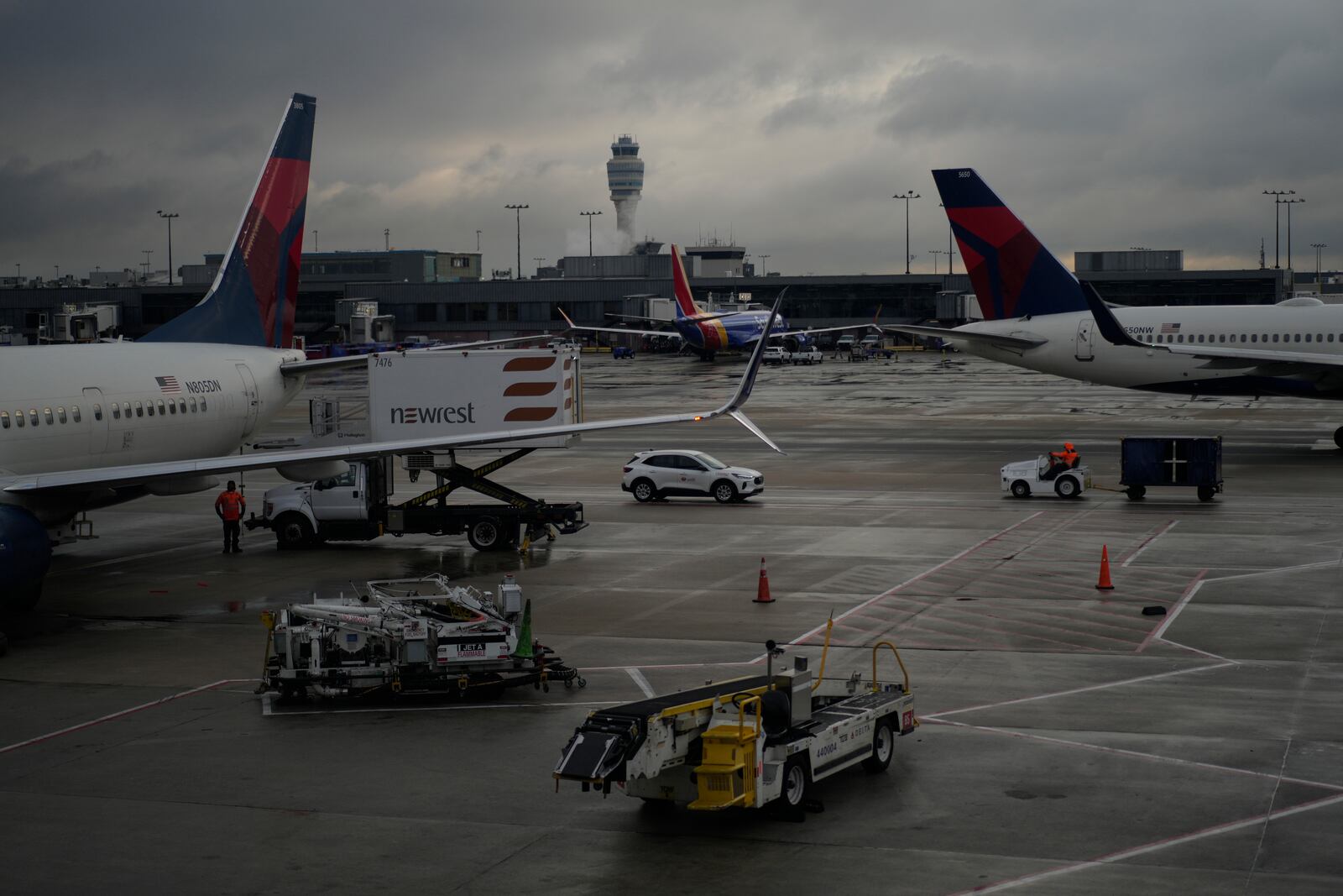 Delta Airlines planes are loaded along the B Concourse at the Hartsfield-Jackson International Airport, Tuesday, Nov. 26, 2024, in Atlanta. (AP Photo/Carolyn Kaster)