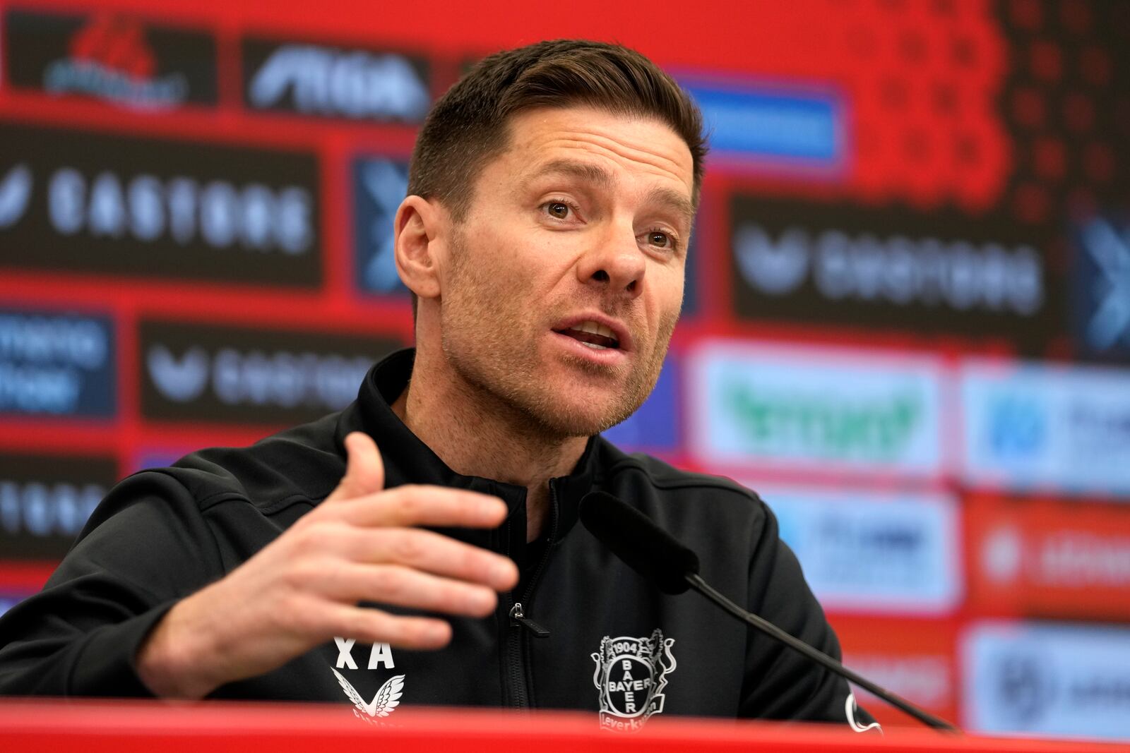 Leverkusen's head coach Xabi Alonso speaks to the media during a press conference ahead of the Bundesliga soccer match between Bayer Leverkusen and Bayern Munich in Leverkusen, Germany, Friday, Feb. 14, 2025. (AP Photo/Martin Meissner)