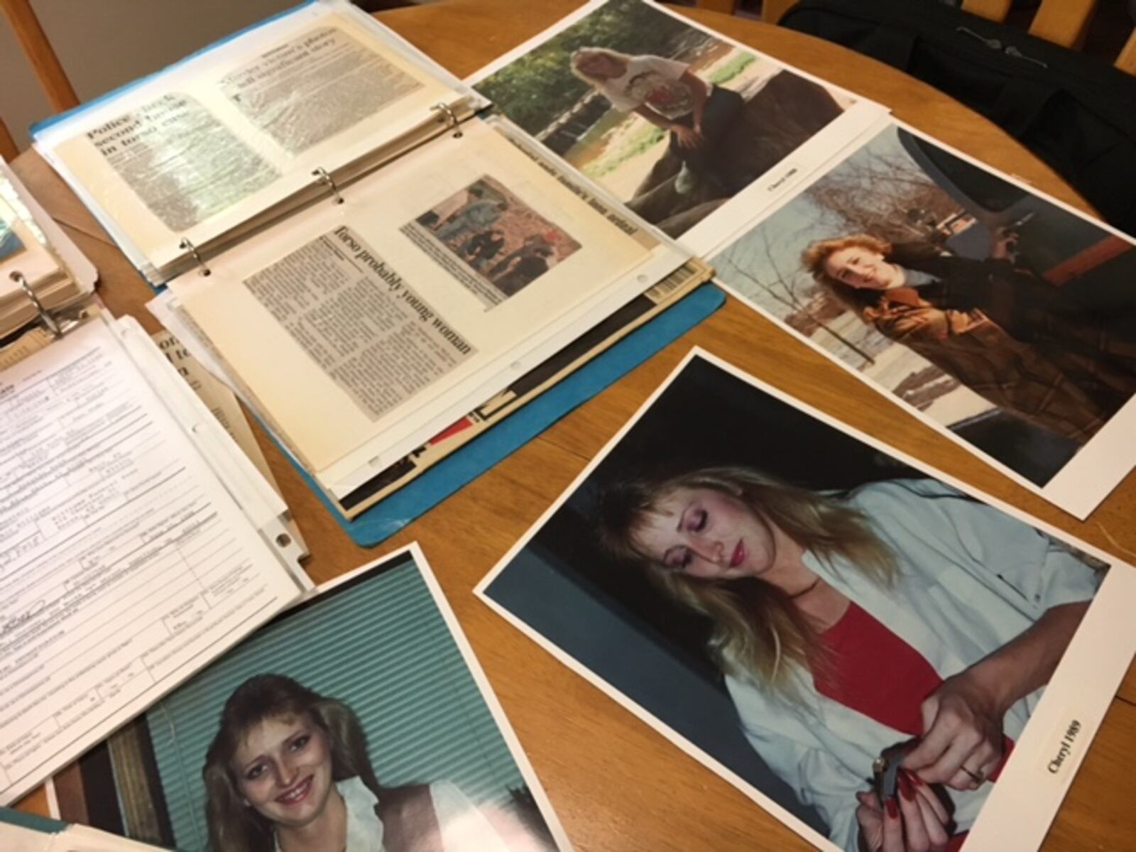 Some of the hundreds of newspaper clippings collected by Karla Edwards about the murder of her sister Cheryl Durkin and the conviction of James Lawson, as well as photos of Durkin. 