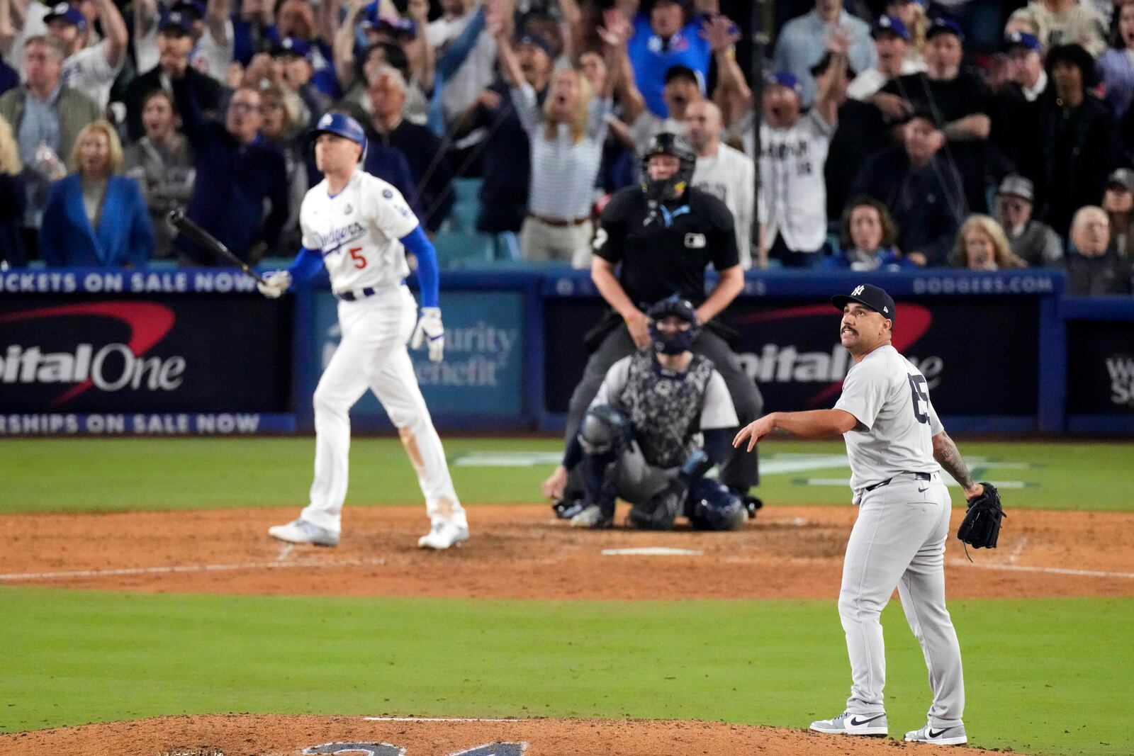 FILE - New York Yankees relief pitcher Nestor Cortes, right, watches as Los Angeles Dodgers' Freddie Freeman, left, hits a walk-off grand slam home run during the 10th inning in Game 1 of the baseball World Series, Friday, Oct. 25, 2024, in Los Angeles. (AP Photo/Mark J. Terrill, File)