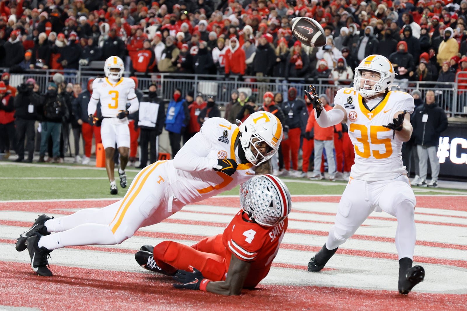 Tennessee defensive back Will Brooks, right, catches a tipped ball for an interception against Ohio State during the first half in the first round of the College Football Playoff, Saturday, Dec. 21, 2024, in Columbus, Ohio. (AP Photo/Jay LaPrete)