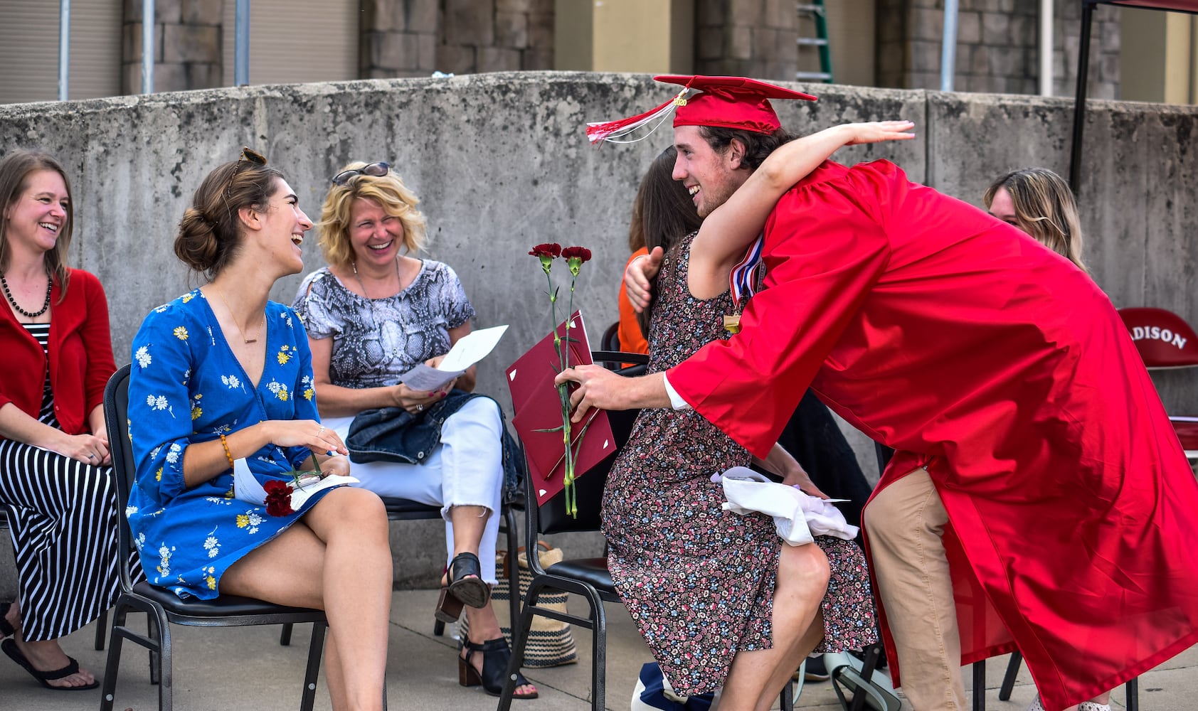 Madison High School drive-thru graduation ceremony at Land of Illusion