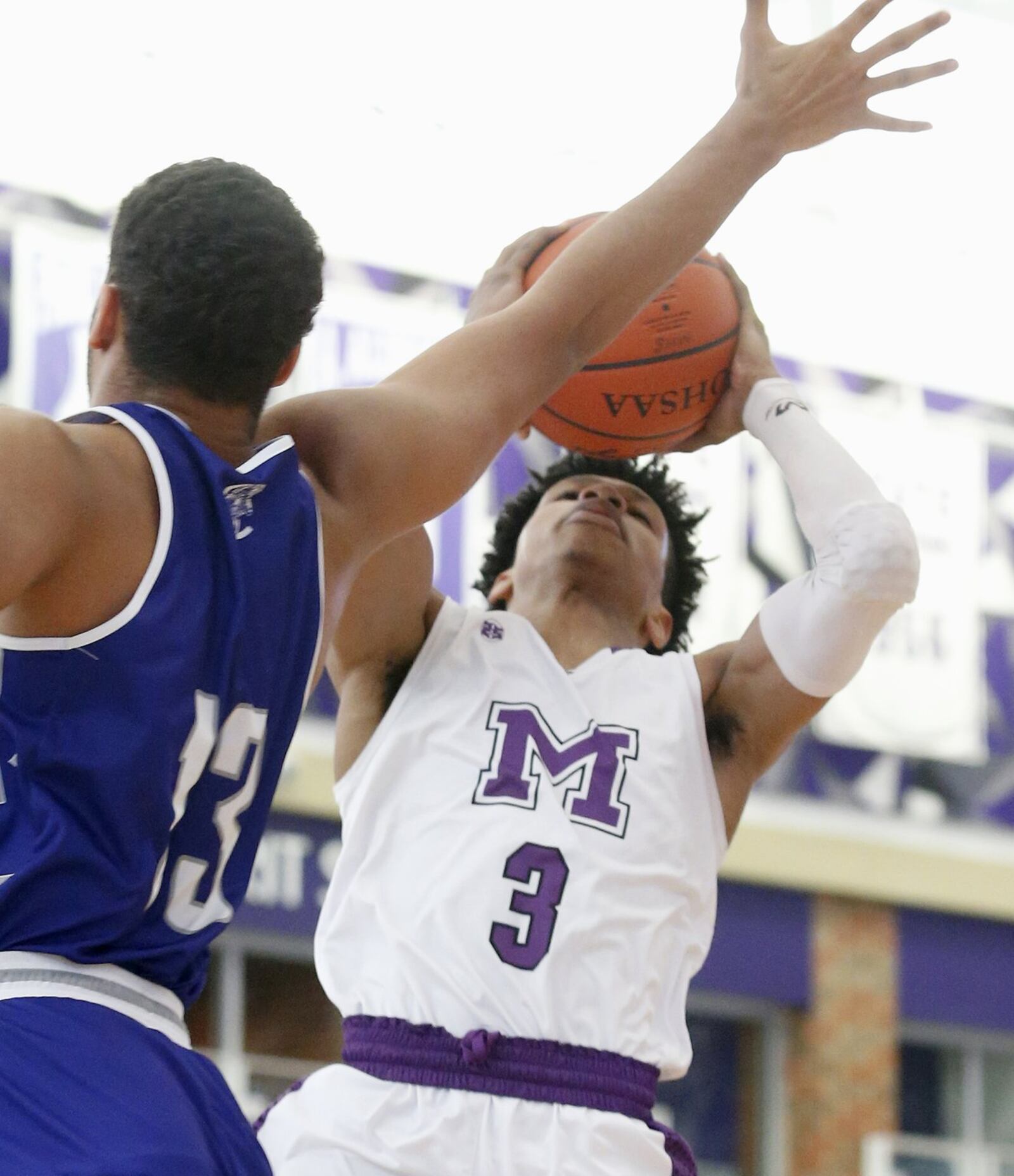 Middletown guard Kei’Aunte Powell shoots over Kobe Antwi of Crestwood Prep (Canada) on Sunday during the inaugural Midwest King Classic at Wade E. Miller Arena in Middletown. Crestwood won 64-50. CONTRIBUTED PHOTO BY E.L. HUBBARD