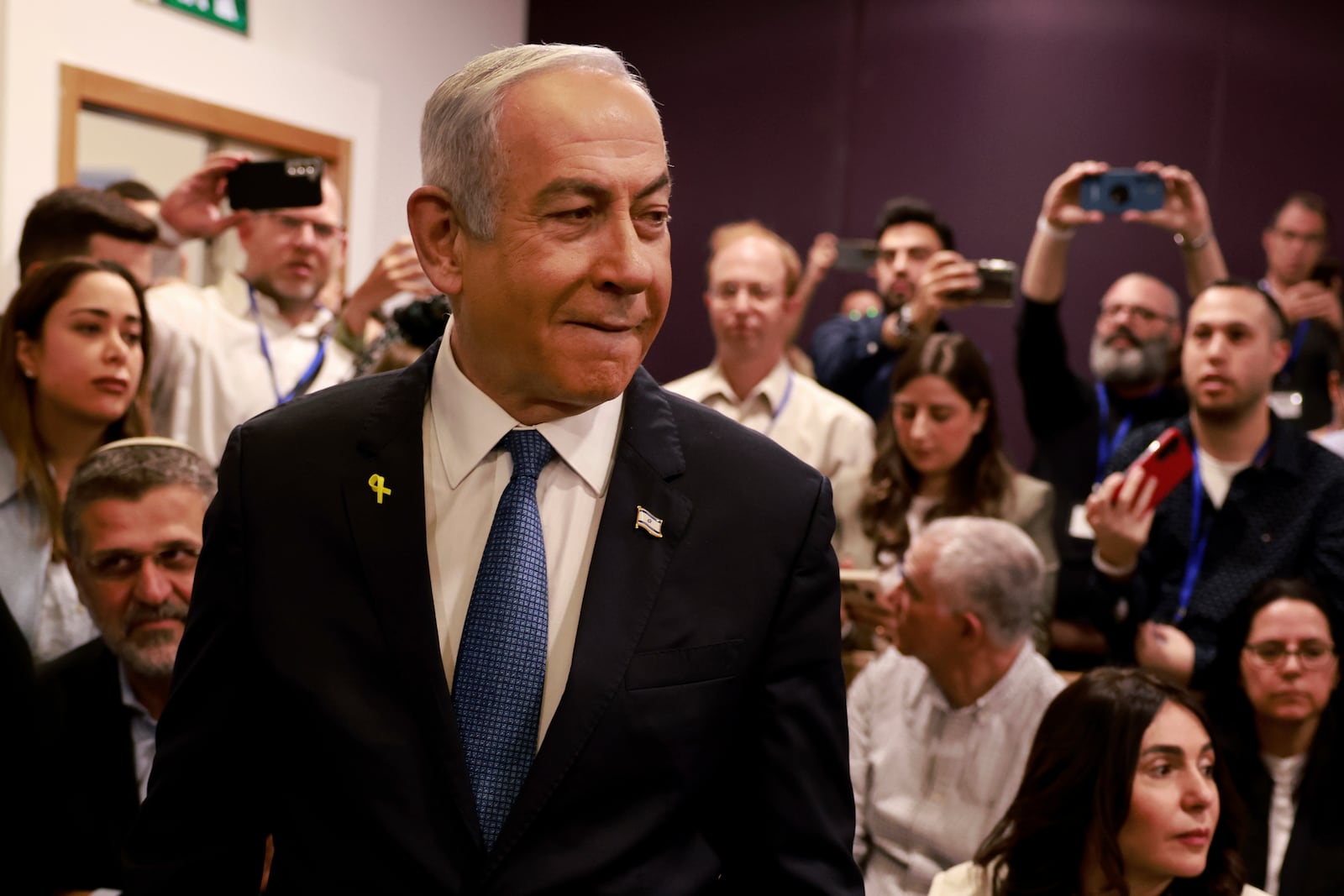 Israeli Prime Minister Benjamin Netanyahu arrives at the district court for his long-running trial for alleged corruption, in Tel Aviv, Israel, Tuesday, Dec. 10, 2024. (Menahem Kahana/Pool Photo via AP)