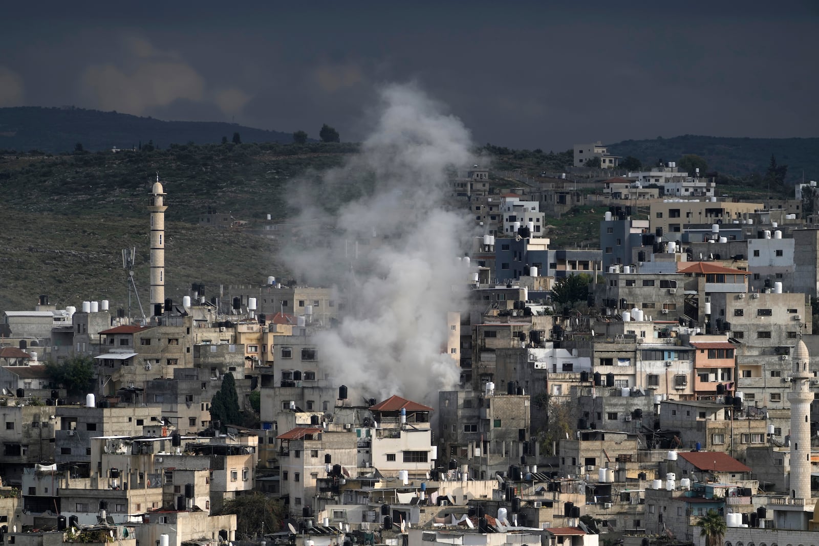 Smoke rises from an ongoing Israeli military operation in the West Bank Nur Shams refugee camp, Wednesday, Feb. 12, 2025. (AP Photo/Majdi Mohammed)