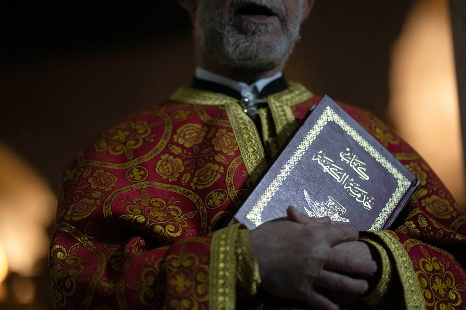 Priest Abuna Mata attends the Christmas mass in the Greek Orthodox convent Saint Takla, in Maaloula, some 60 km northern Damascus, Syria, Tuesday, Dec. 24, 2024. (AP Photo/Leo Correa)