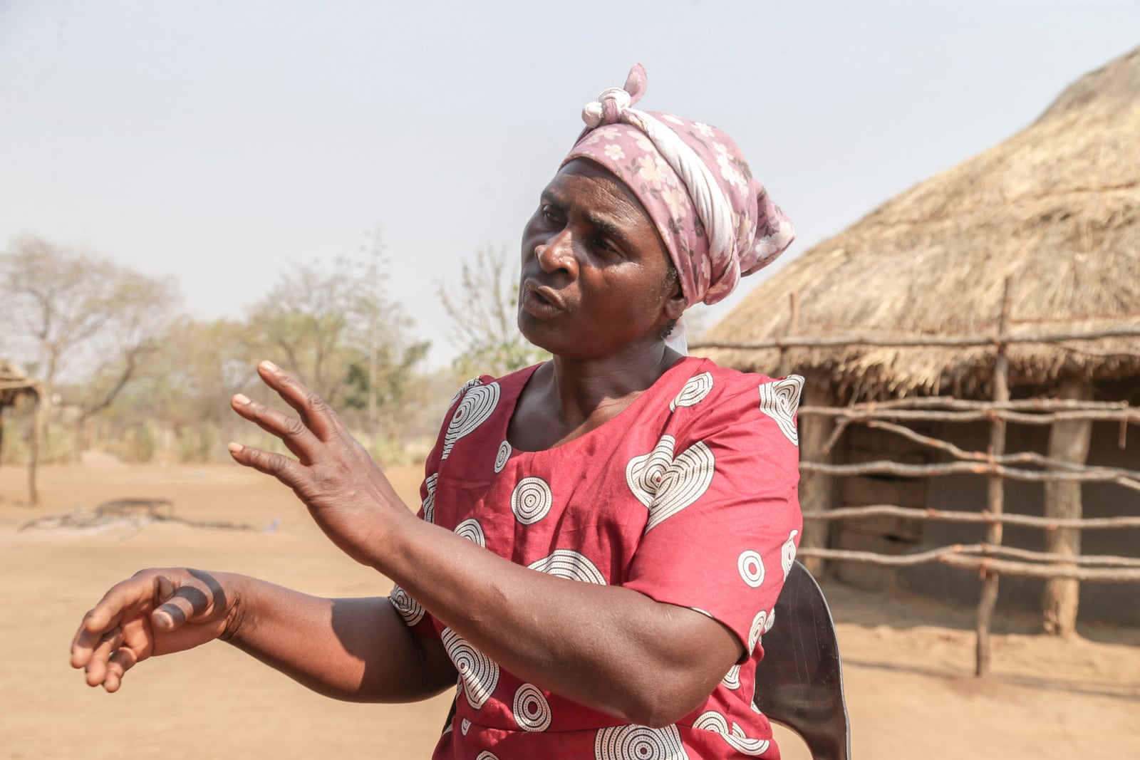 Maggot breeder, Chemari Choumumba works at a production tank of maggots at her home in Chiredzi, Zimbabwe Wednesday, Sept. 18, 2024. (AP Photo/Aaron Ufumeli)