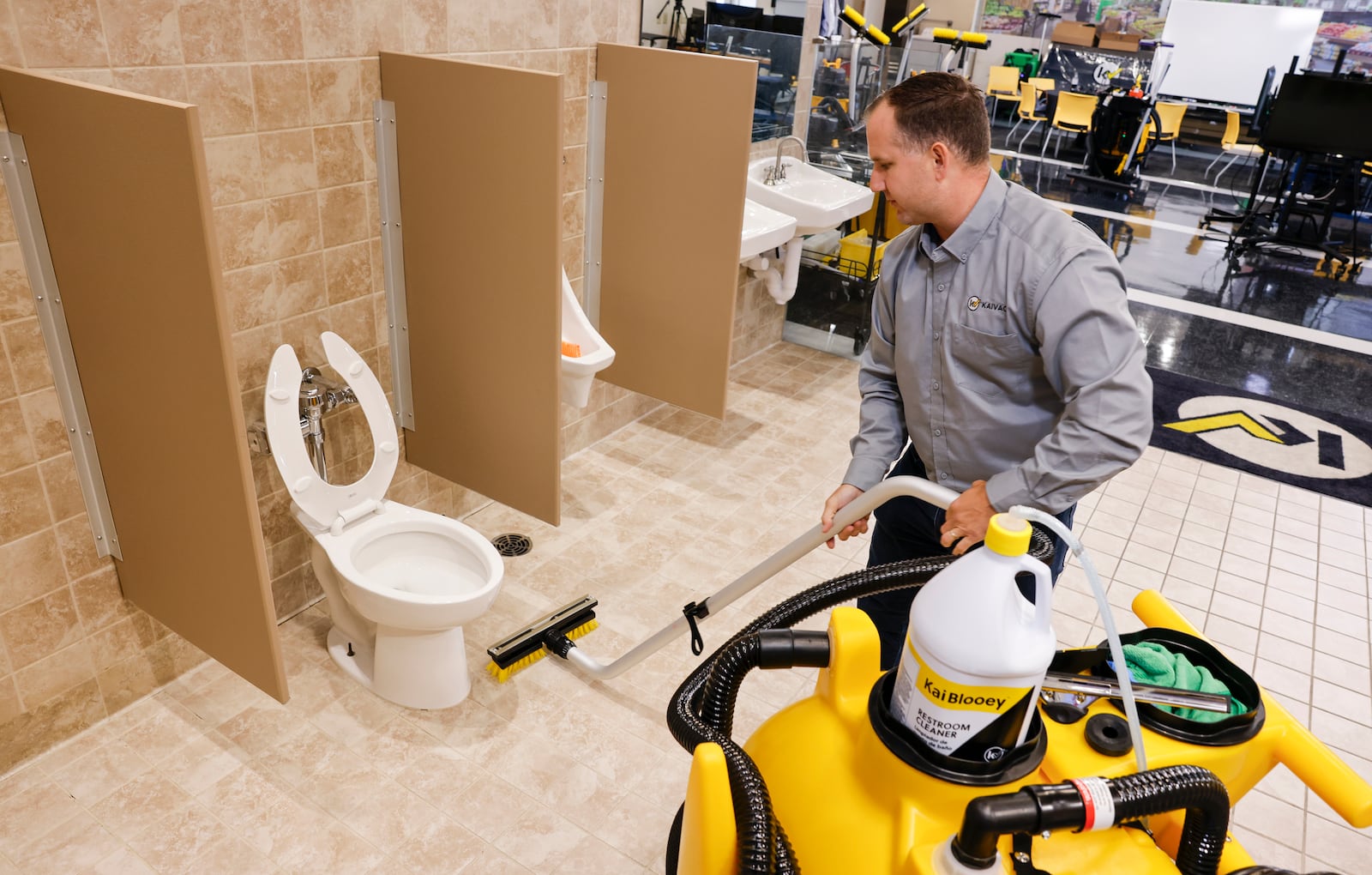 Jim Pickrel, director of marketing with Kaivac, shows off their no touch cleaning machine in the demo training room Wednesday, Aug. 7, 2024 in Hamilton. Kaivac designs and manufactures a variety of specialty cleaning machines in their Hamilton facility. NICK GRAHAM/STAFF