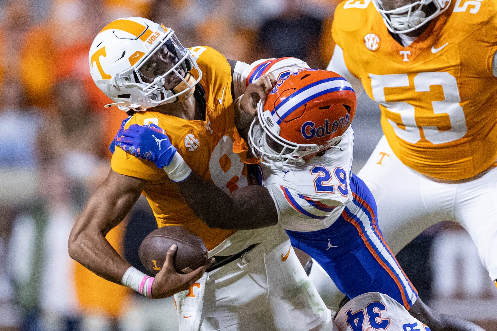 Tennessee quarterback Nico Iamaleava (8) is tackled by Florida linebacker Jaden Robinson (29) during the first half of an NCAA college football game, Saturday, Oct. 12, 2024, in Knoxville, Tenn. (AP Photo/Wade Payne)