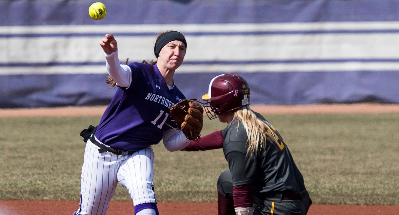 Northwestern University second baseman Rachel Lewis attempts to turn a double play in a game against Minnesota last month in Evanston, Ill. PHOTO COURTESY OF NORTHWESTERN ATHLETICS