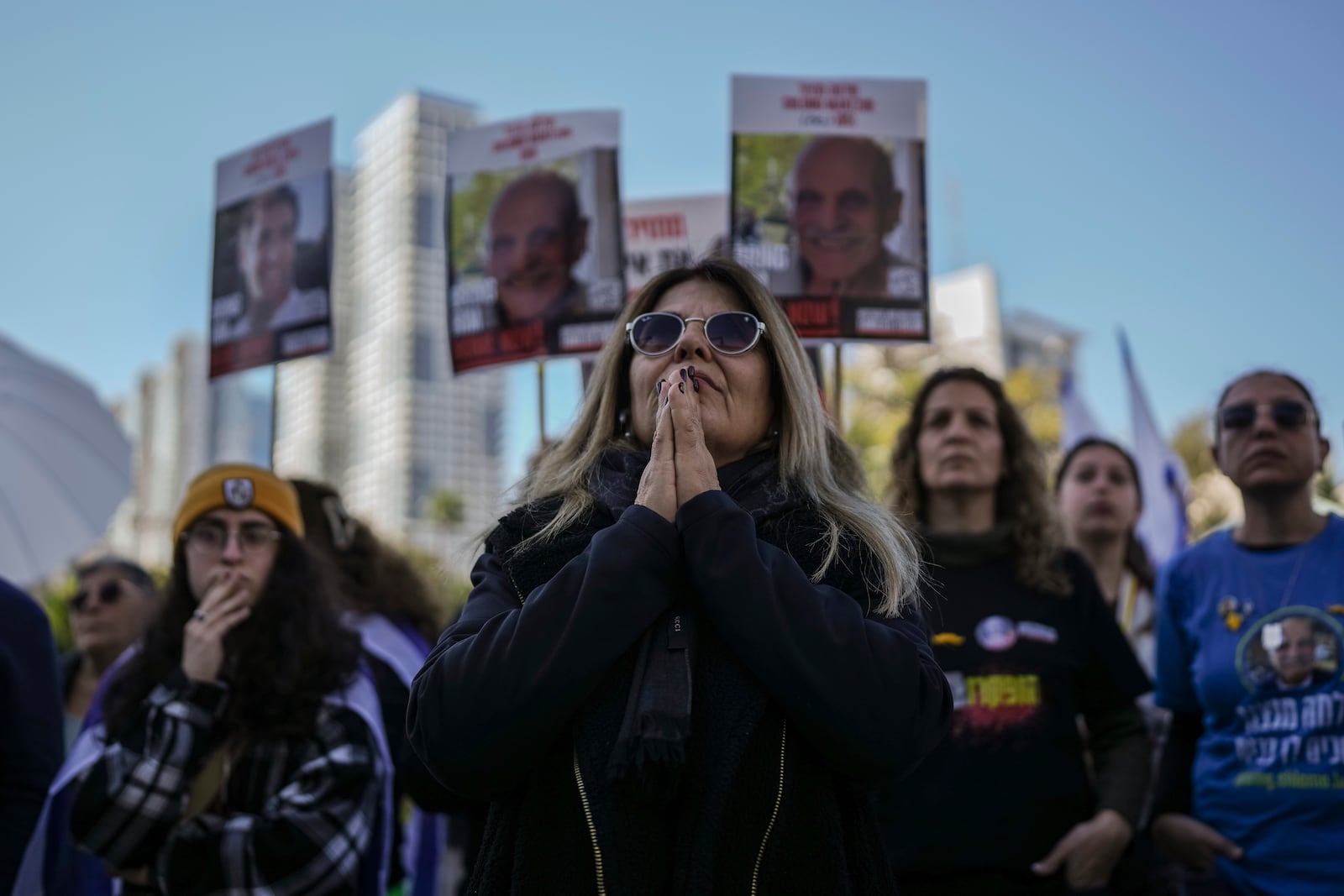 Israelis gather at Hostages Square, waiting for the release of Iair Horn, Sagui Dekel Chen, and Alexander (Sasha) Troufanov in Tel Aviv, Israel, Saturday, Feb. 15, 2025. (AP Photo/Oded Balilty)