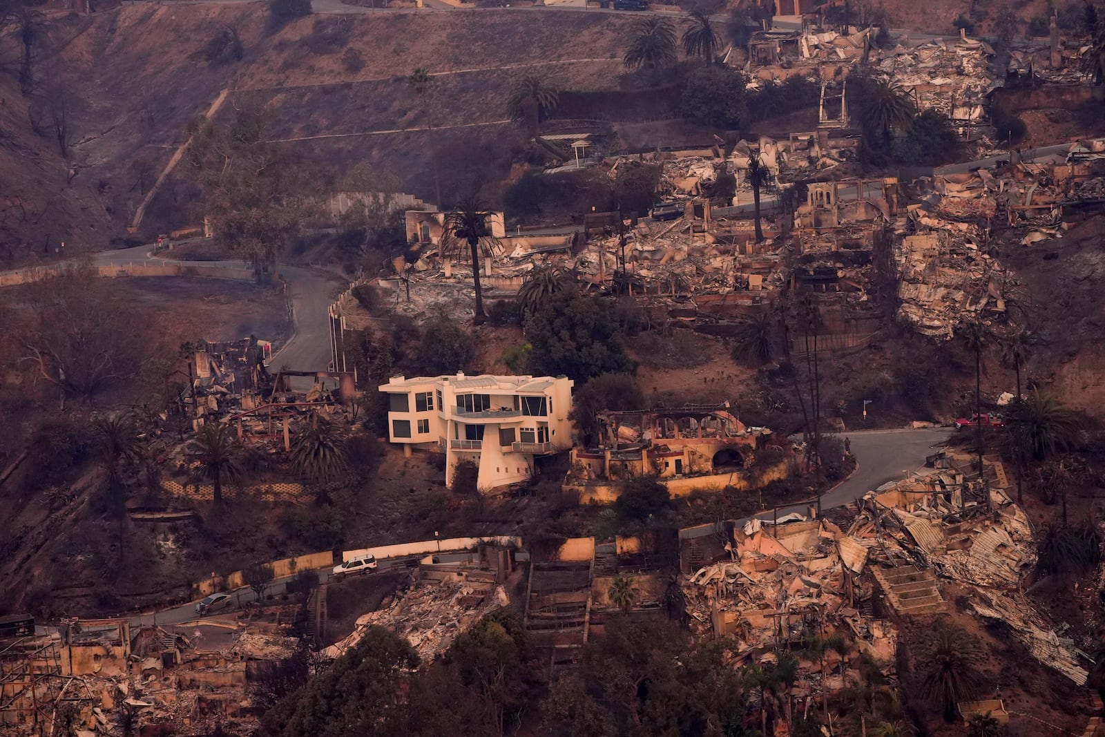 The devastation from the Palisades Fire is seen from the air in the Pacific Palisades neighborhood of Los Angeles, Thursday, Jan. 9, 2025. (AP Photo/Mark J. Terrill)