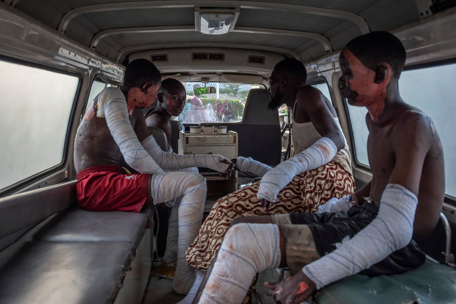 Victims of a tanker explosion from Majiya town receive treatment inside an ambulance at the Aminu Kano teaching hospital in Kano Nigeria, Wednesday, Oct. 16, 2024. (AP Photo/Sani Maikatanga)