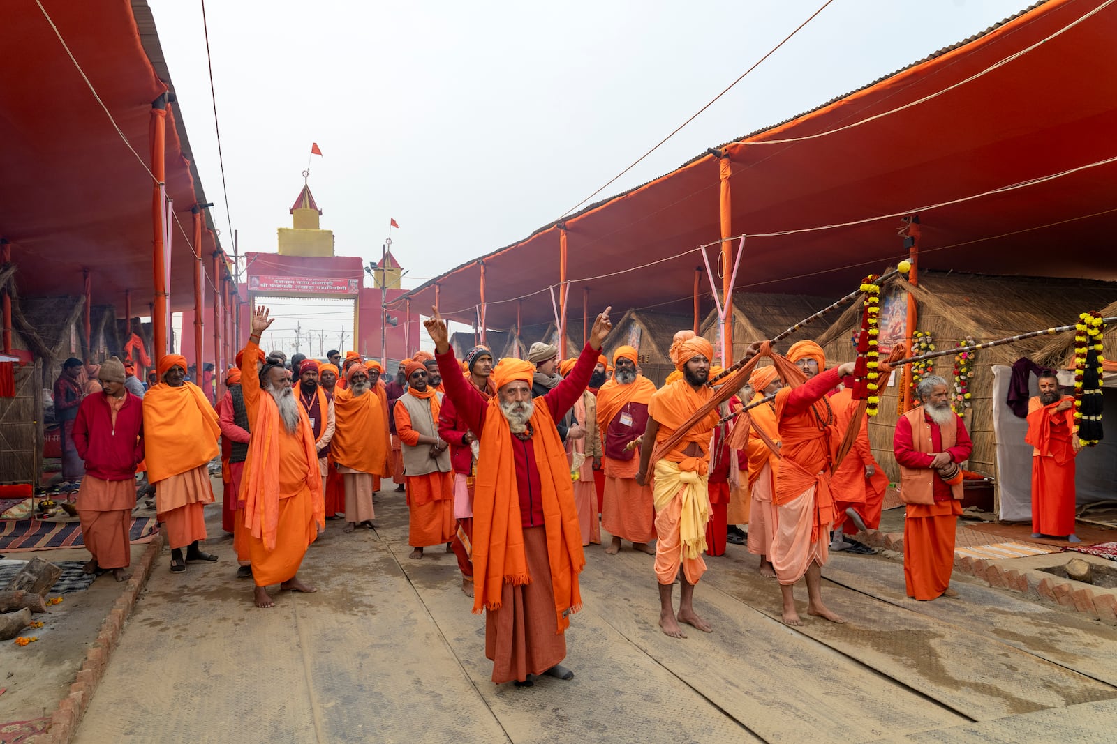 Hindu holy men arrive in a procession at an akhara where they will stay during the 45-day-long Maha Kumbh festival beginning on Jan. 13, at the confluence of the Ganges, the Yamuna and the mythical Saraswati rivers, in Prayagraj, India, Sunday, Jan. 12, 2025. (AP Photo/Ashwini Bhatia)