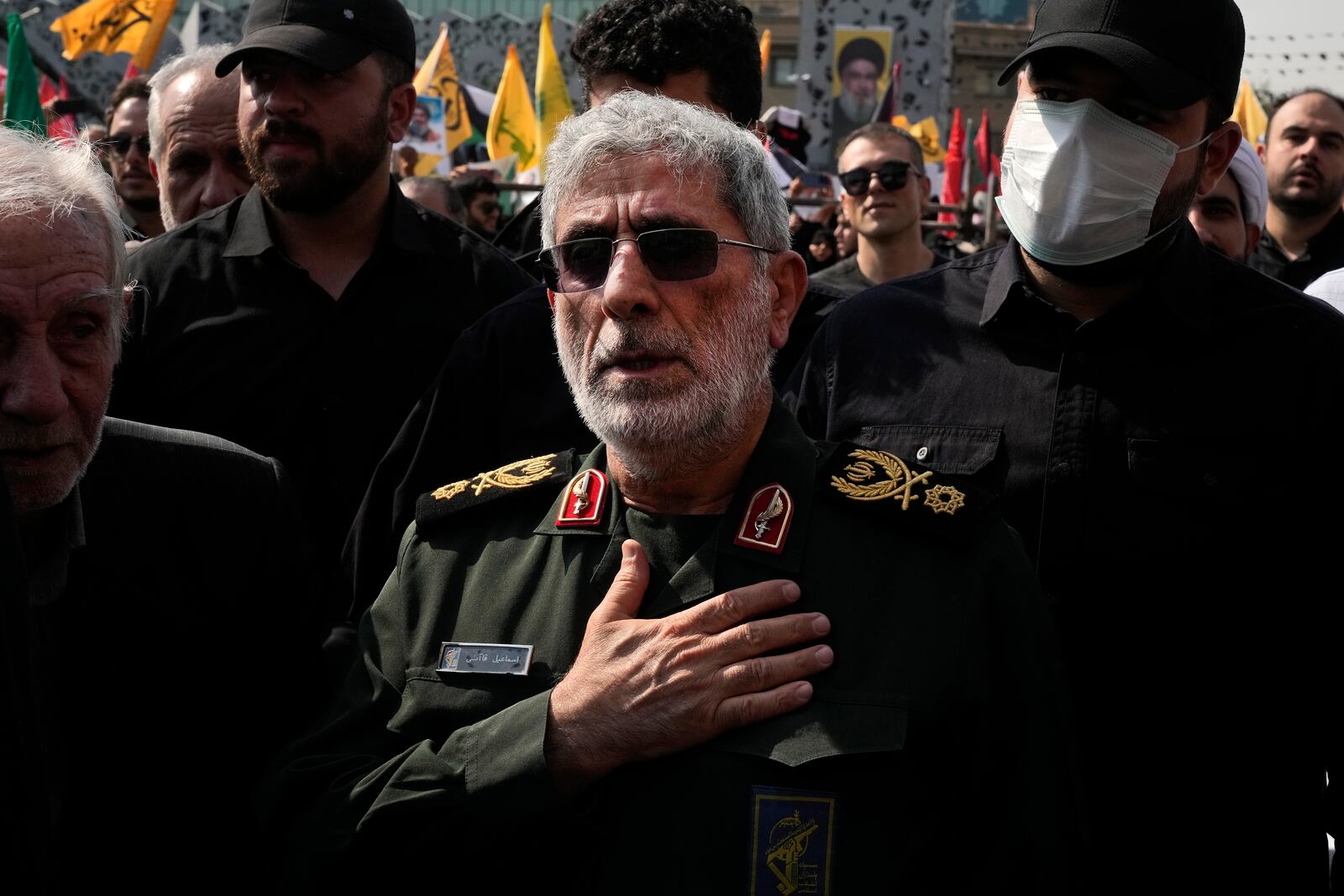 Commander of the Iran's Revolutionary Guard Quds Force, Gen. Esmail Qaani, mourns during the funeral ceremony of the late Revolutionary Guard Gen. Abbas Nilforushan, who was killed in an Israeli airstrike in Beirut in late September, in Tehran, Iran, Tuesday, Oct. 15, 2024. (AP Photo/Vahid Salemi)