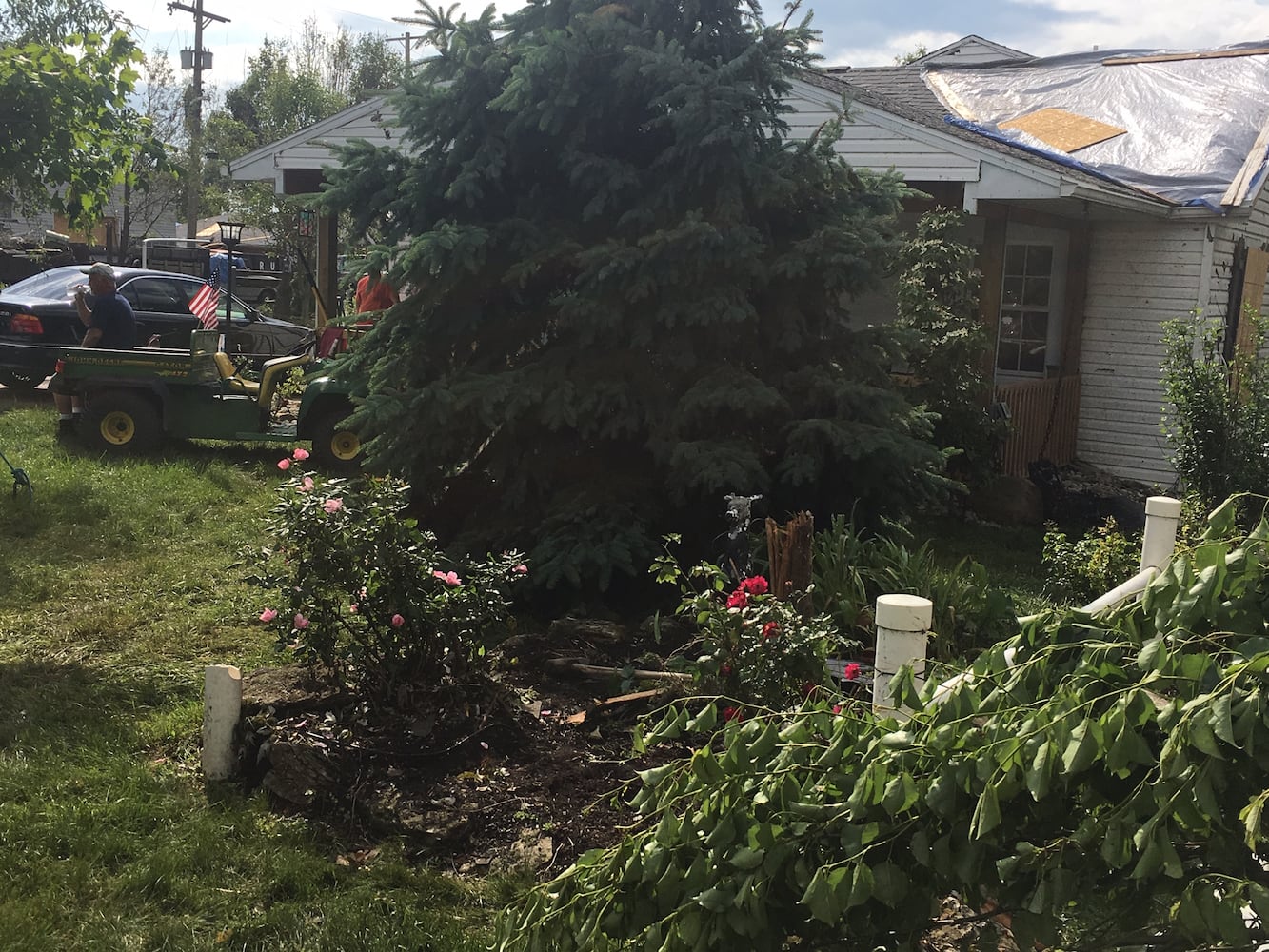 PHOTOS: Tornado-damaged communities dig out, clean up