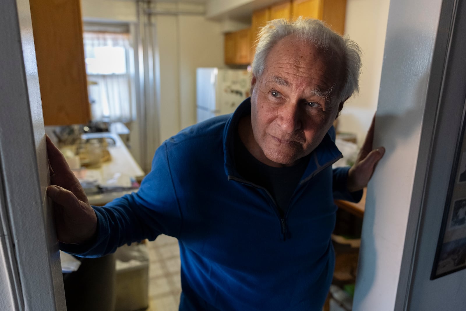 Ed Yaker, who has a Copper stove, an electric induction stove, appears in his apartment on Feb. 10, 2025, in New York. (AP Photo/John Minchillo)