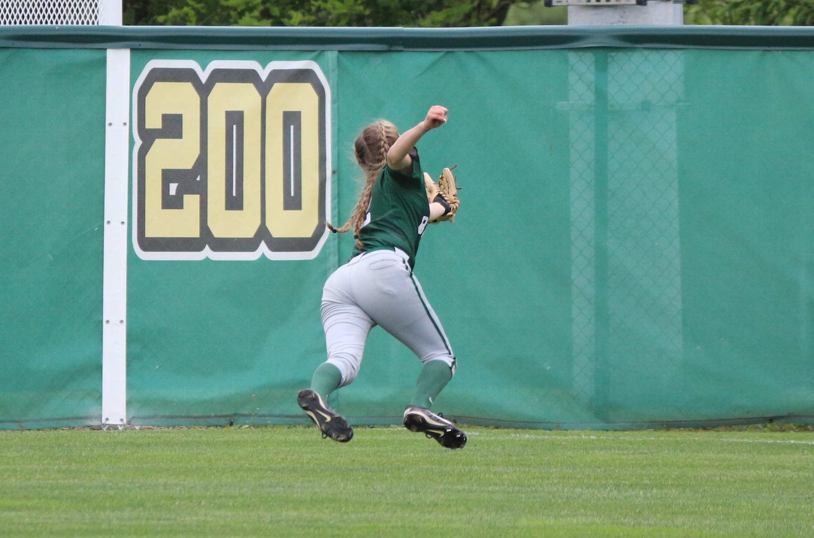 Badin right fielder Anna Cantwell makes a diving catch to end the second inning of a Division III regional semifinal Wednesday against Springfield Northwestern at Wright State University. CONTRIBUTED PHOTO BY GREG BILLING