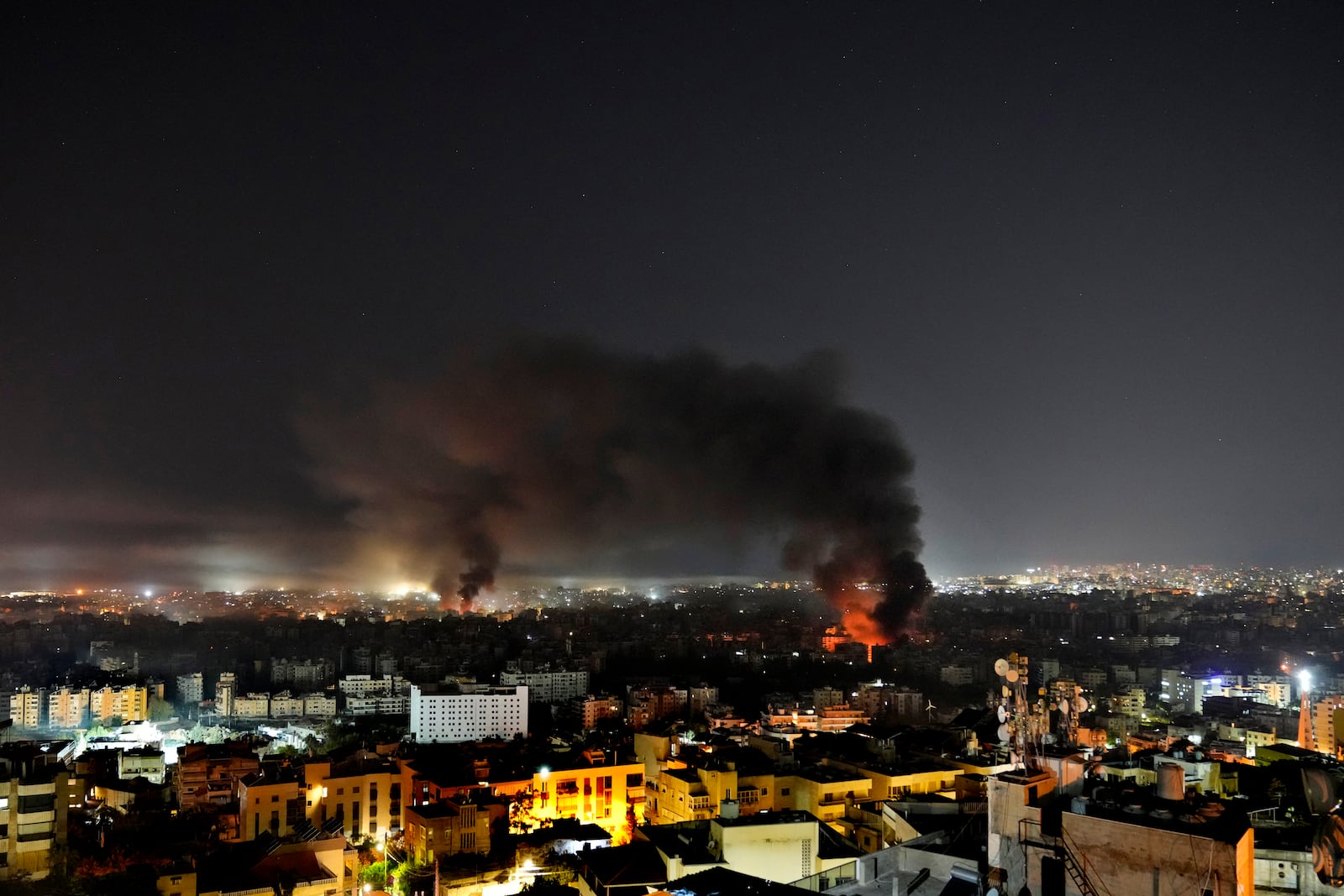 Flame and smoke rises from Israeli airstrikes on Dahiyeh, in the southern suburb of Beirut, Lebanon, early Sunday, Oct. 27, 2024. (AP Photo/Hussein Malla)