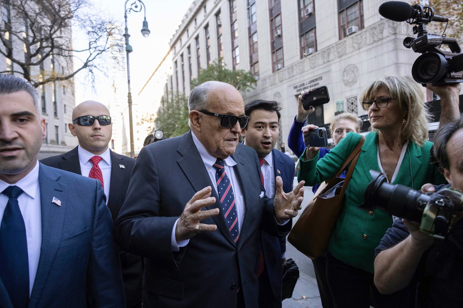 Former New York City Mayor Rudy Giuliani arrives at the court to explain to a federal judge why he hasn't surrendered his valuables as part of a $148 million defamation judgment, in New York, Thursday, Nov. 7, 2024. (AP Photo/Yuki Iwamura)