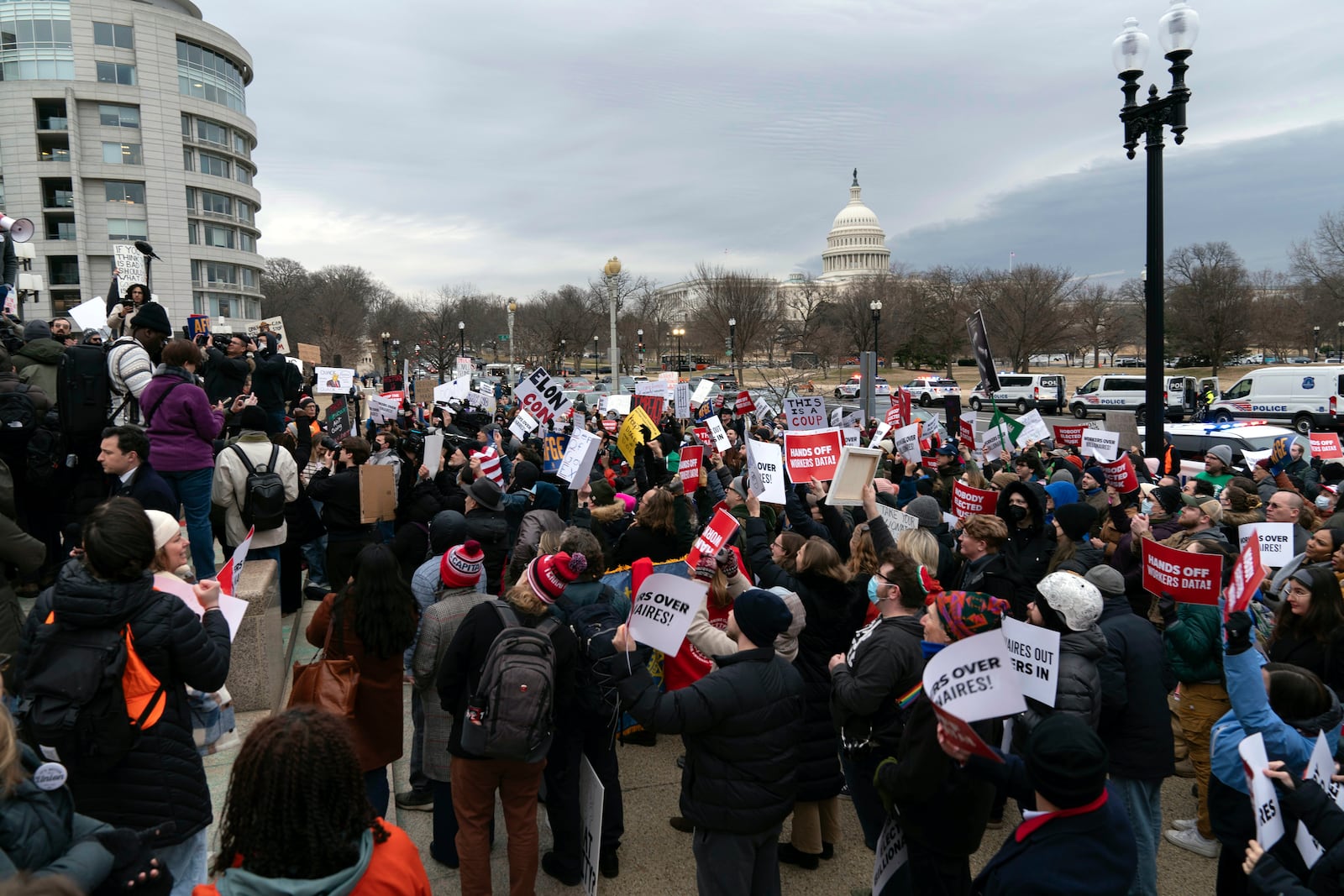 People protest during a rally against Elon Musk outside the U.S. Department of Labor in Washington, Wednesday, Feb. 5, 2025. (AP Photo/Jose Luis Magana)