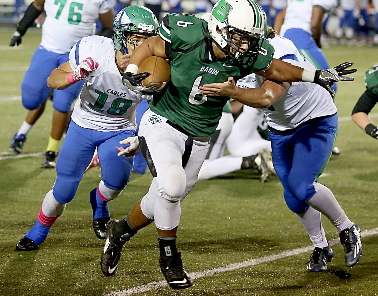 Badin running back Lavassa Martin tries to push past Chaminade Julienne’s Rocky Stark (18) and Noah Burneka during their game at Virgil Schwarm Stadium in Hamilton on Oct. 22, 2016. CONTRIBUTED PHOTO BY E.L. HUBBARD