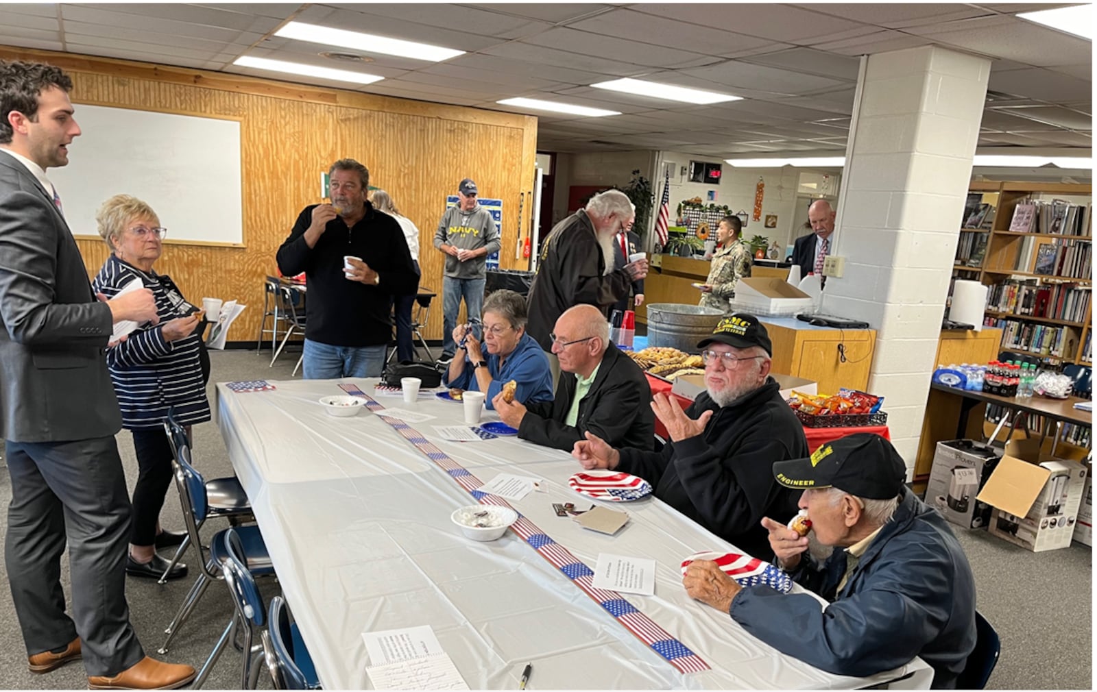 Local veterans enjoy a small reception at Franklin High School following the school's 23rd annual Veterans Day Program. ED RICHTER/STAFF