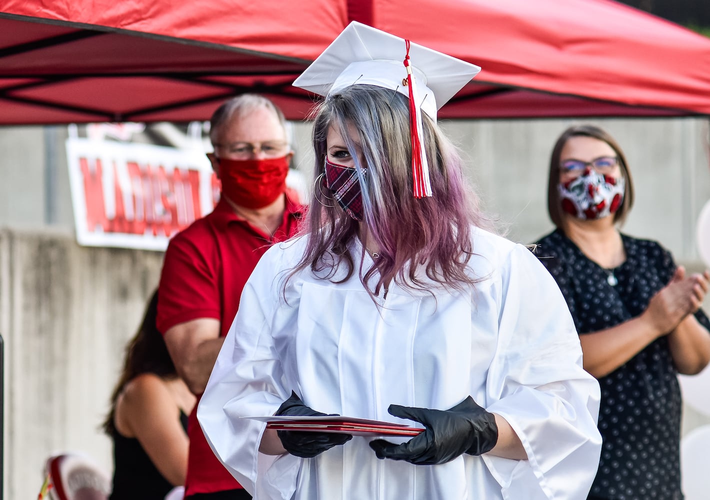 Madison High School drive-thru graduation ceremony at Land of Illusion